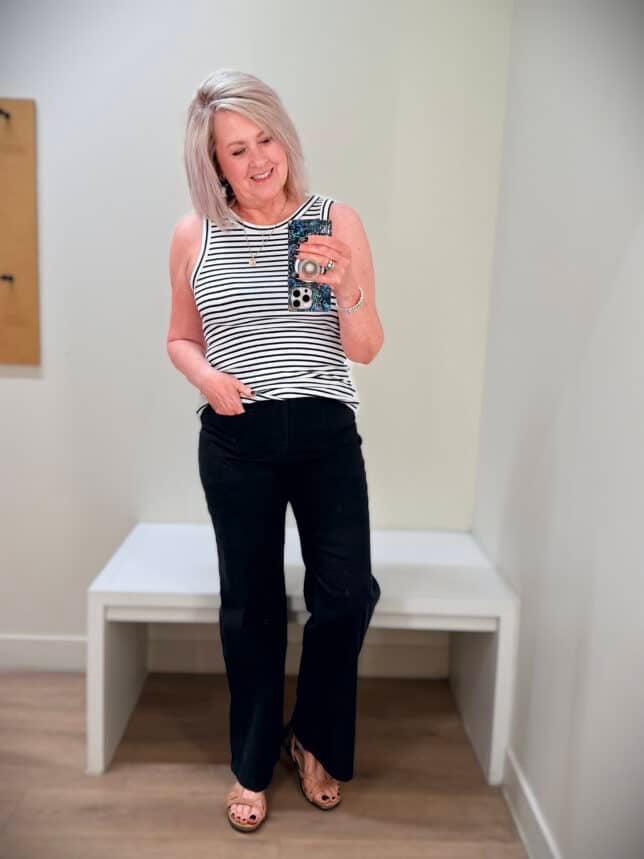 Tania wearing a black and white striped tank top with black pants from J.Crew Factory