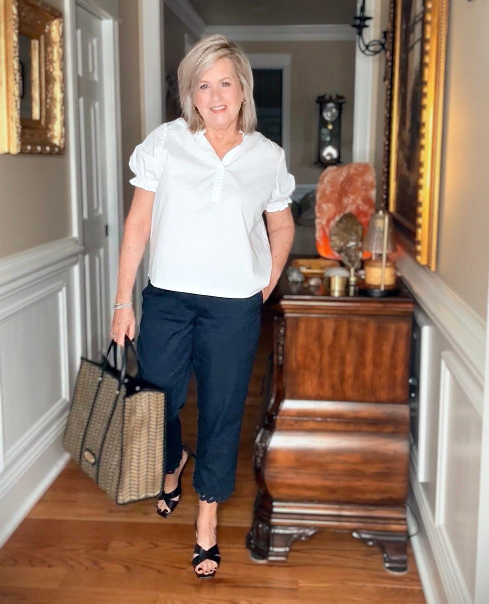 Tania wearing a white puff sleeve top with navy pants from J.Jill