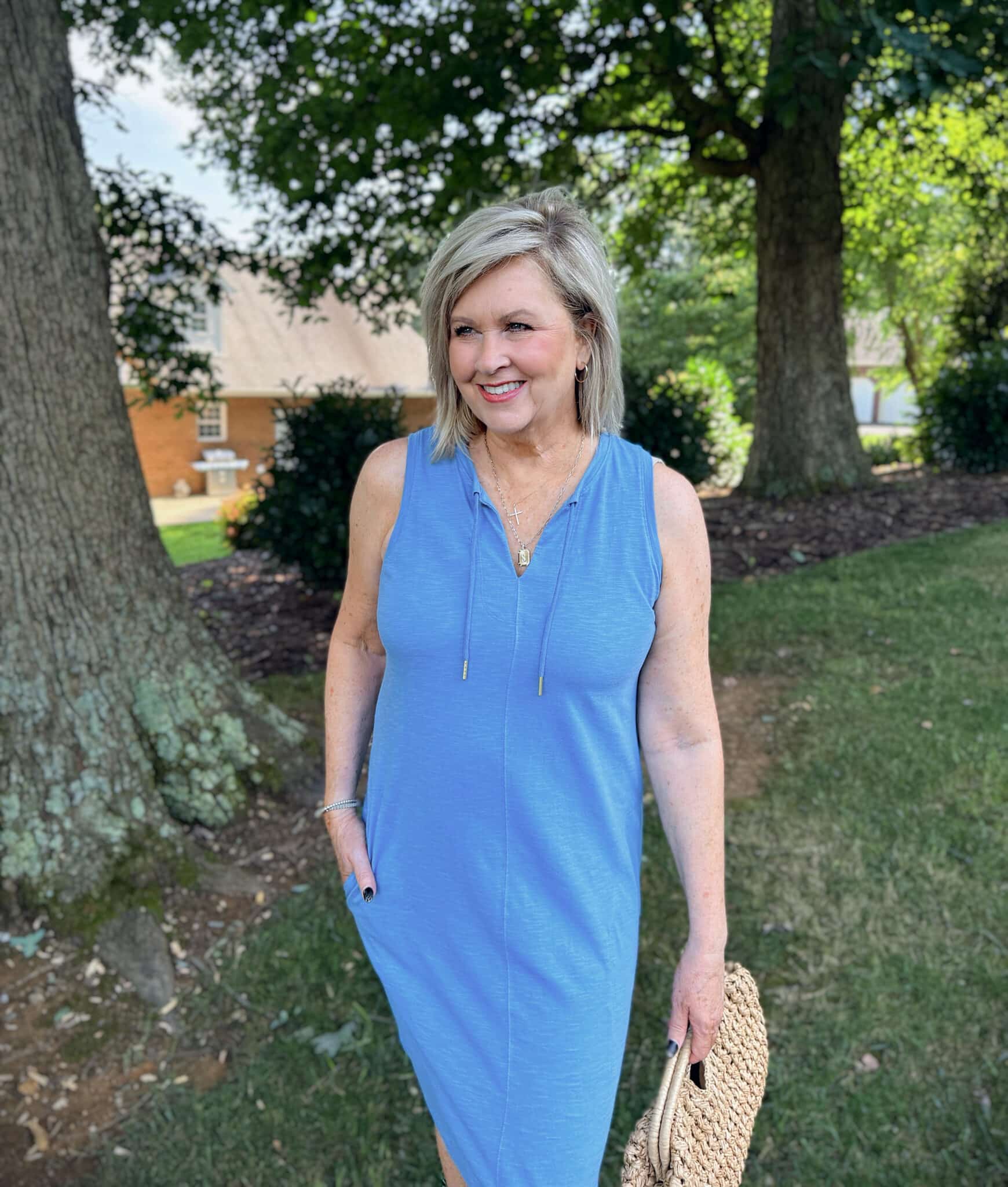 Tania wearing a turquoise dress from Kohl's