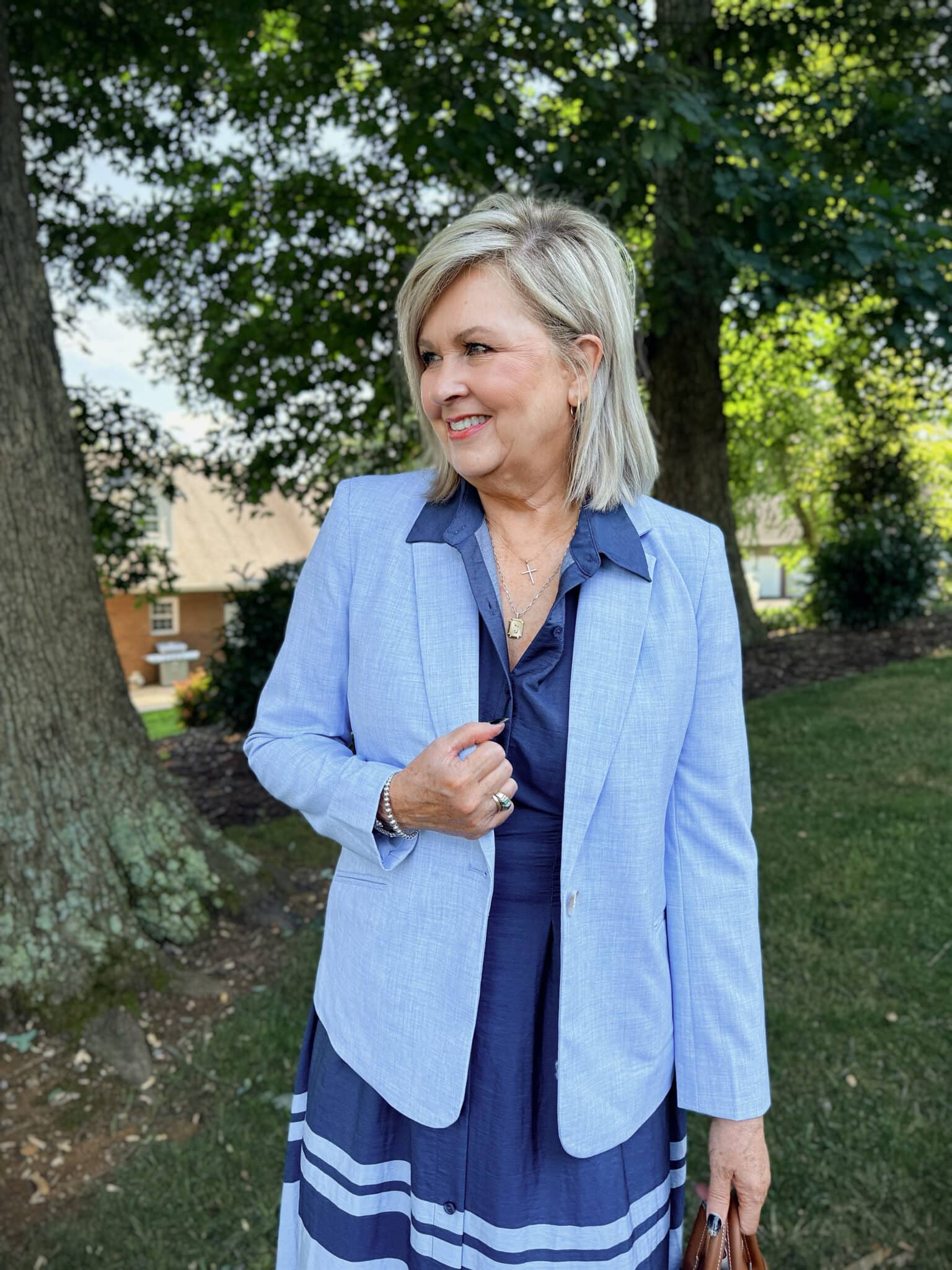 Tania wearing a blue blazer over a midi dress from Kohl's