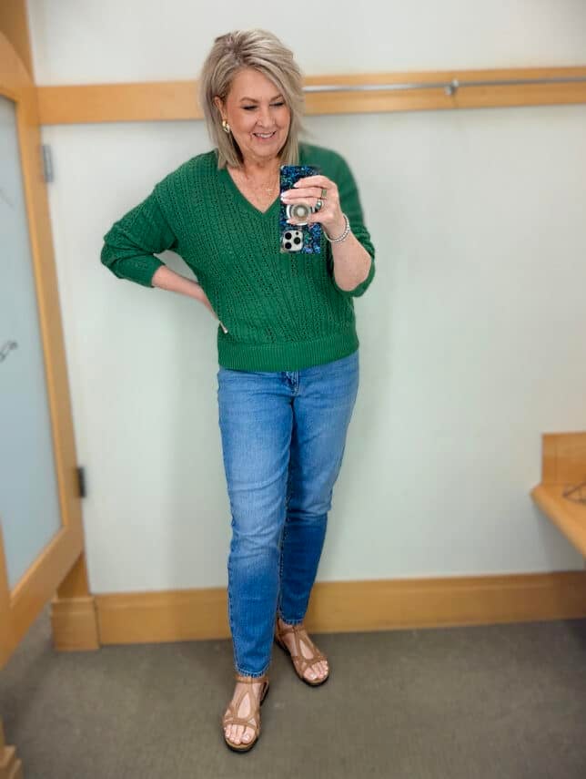 Tania wearing a green sweater and straight leg jeans from Talbots