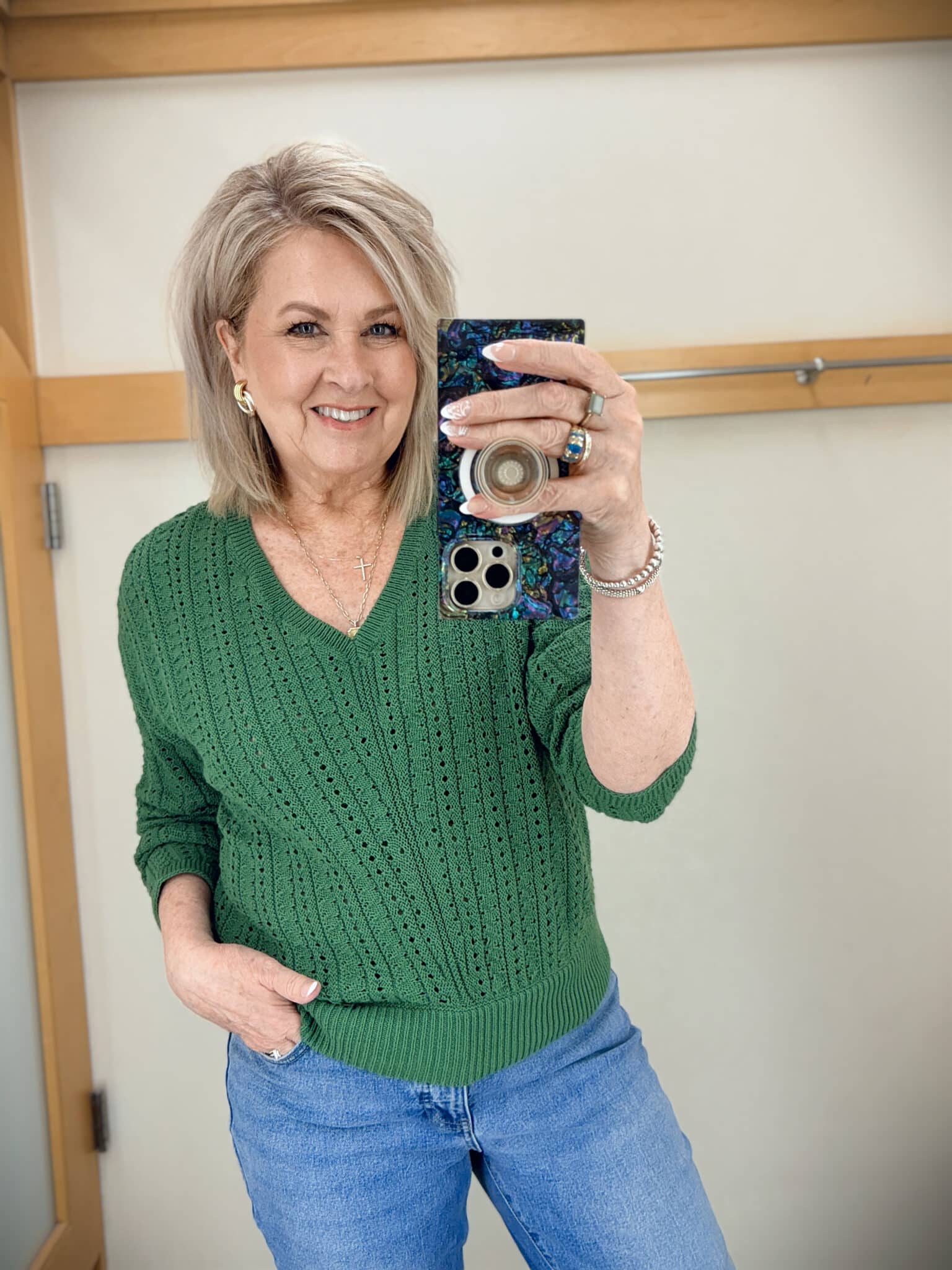 Tania wearing a green sweater from Talbots