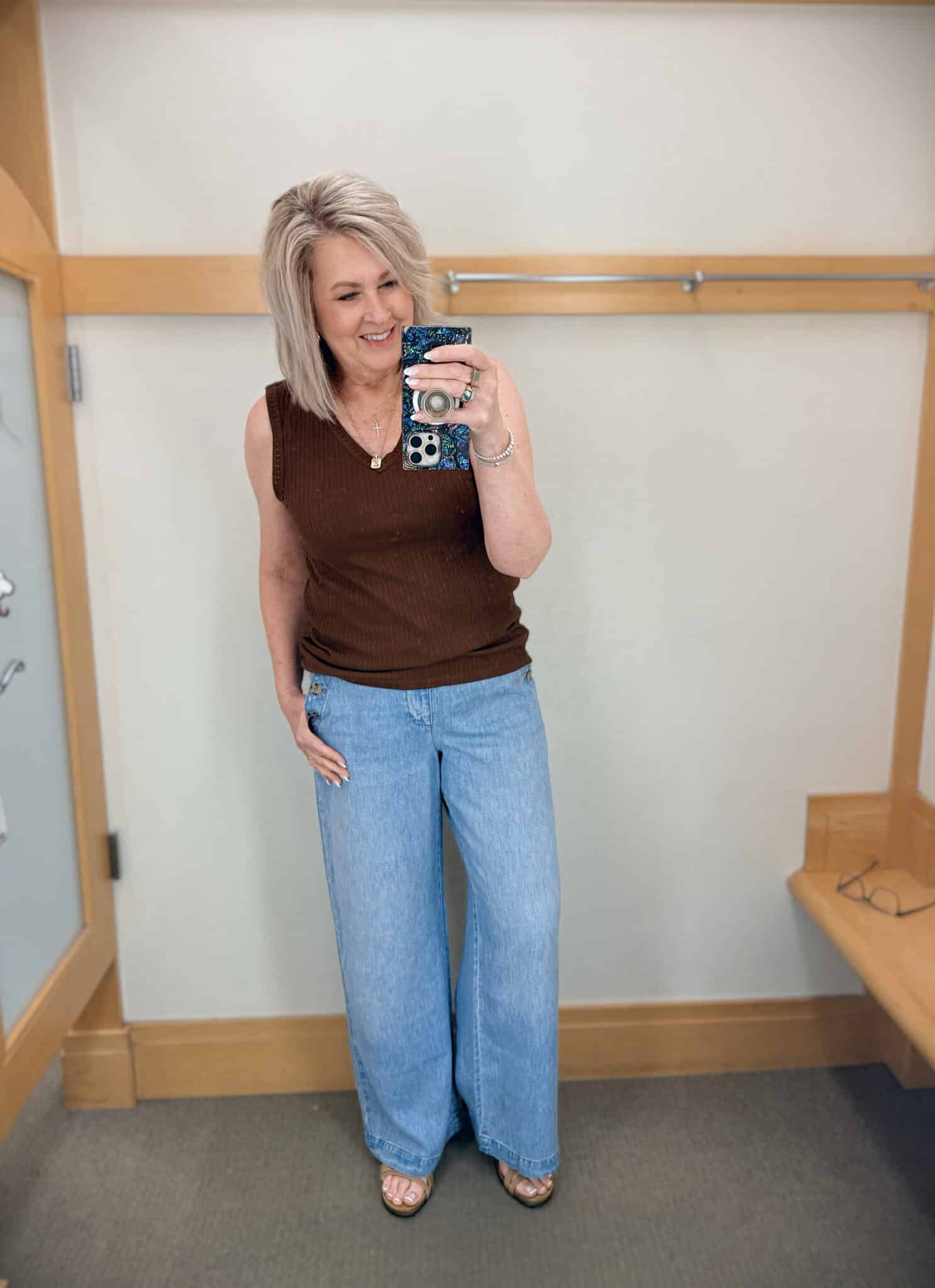 Tania wearing a brown tank and wide leg sailor jeans from Talbots