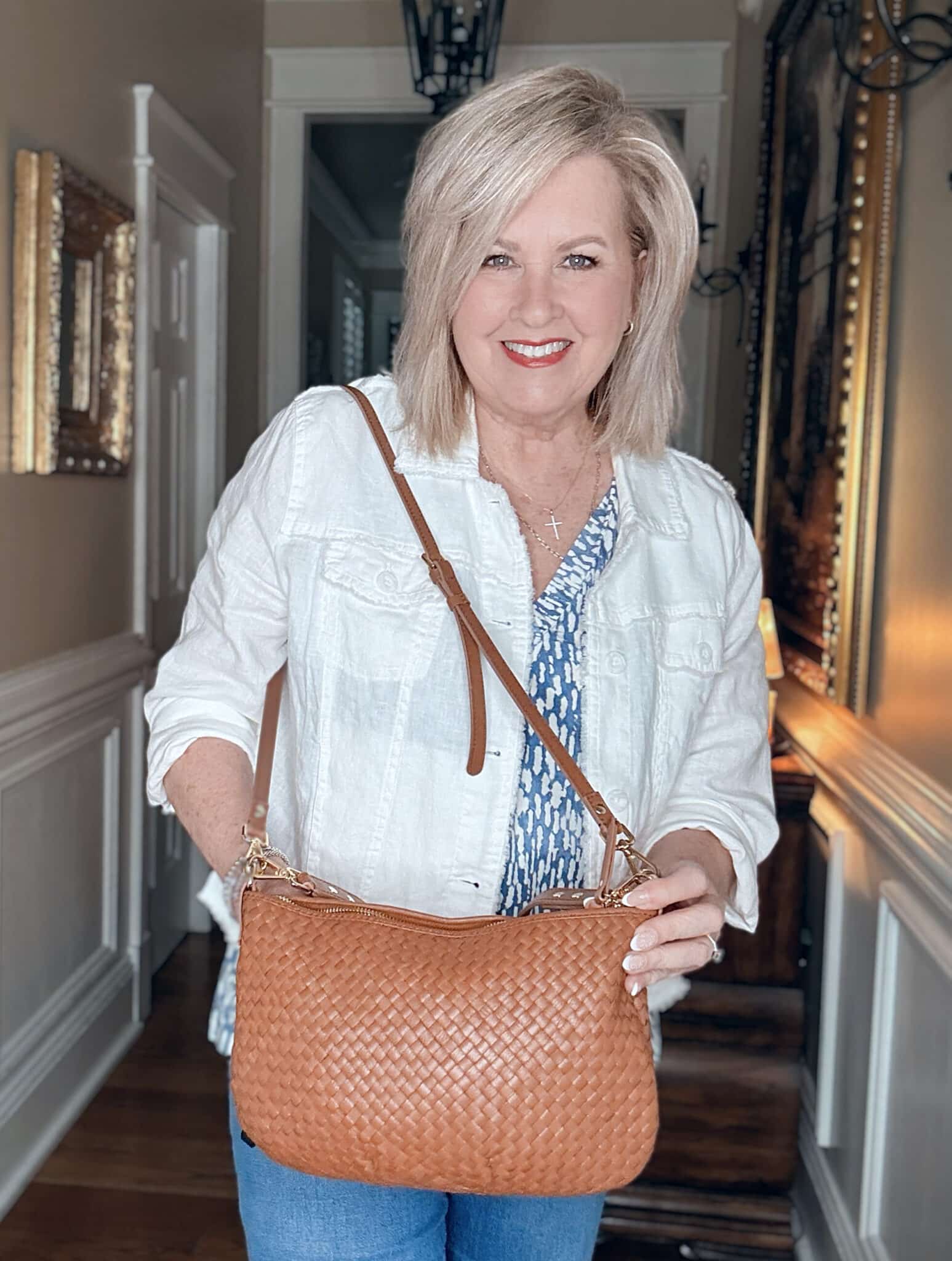 Tania holding a Quince handwoven mini shoulder bag