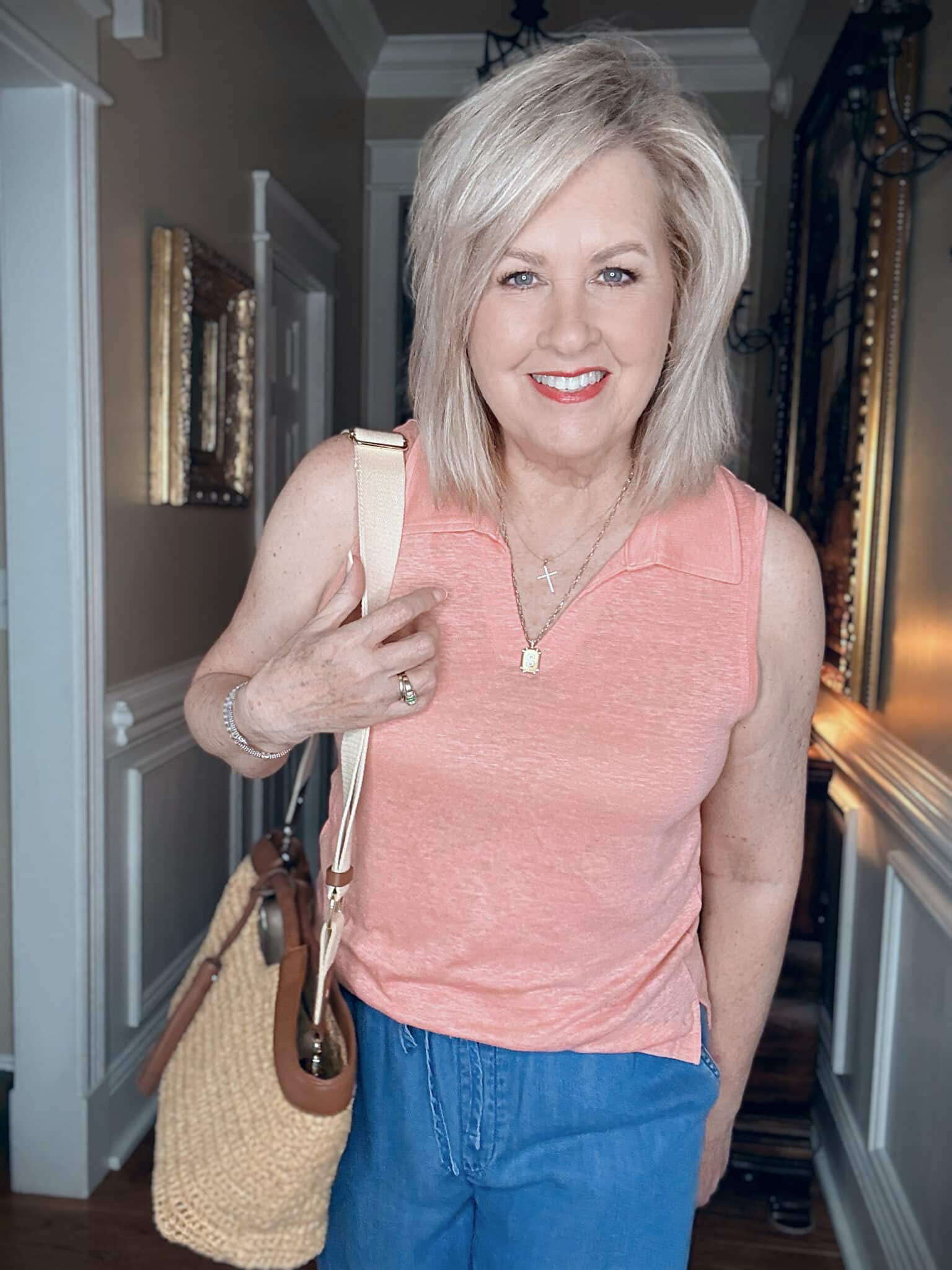 Tania wearing a peach tank with a collar from Tommy Bahama
