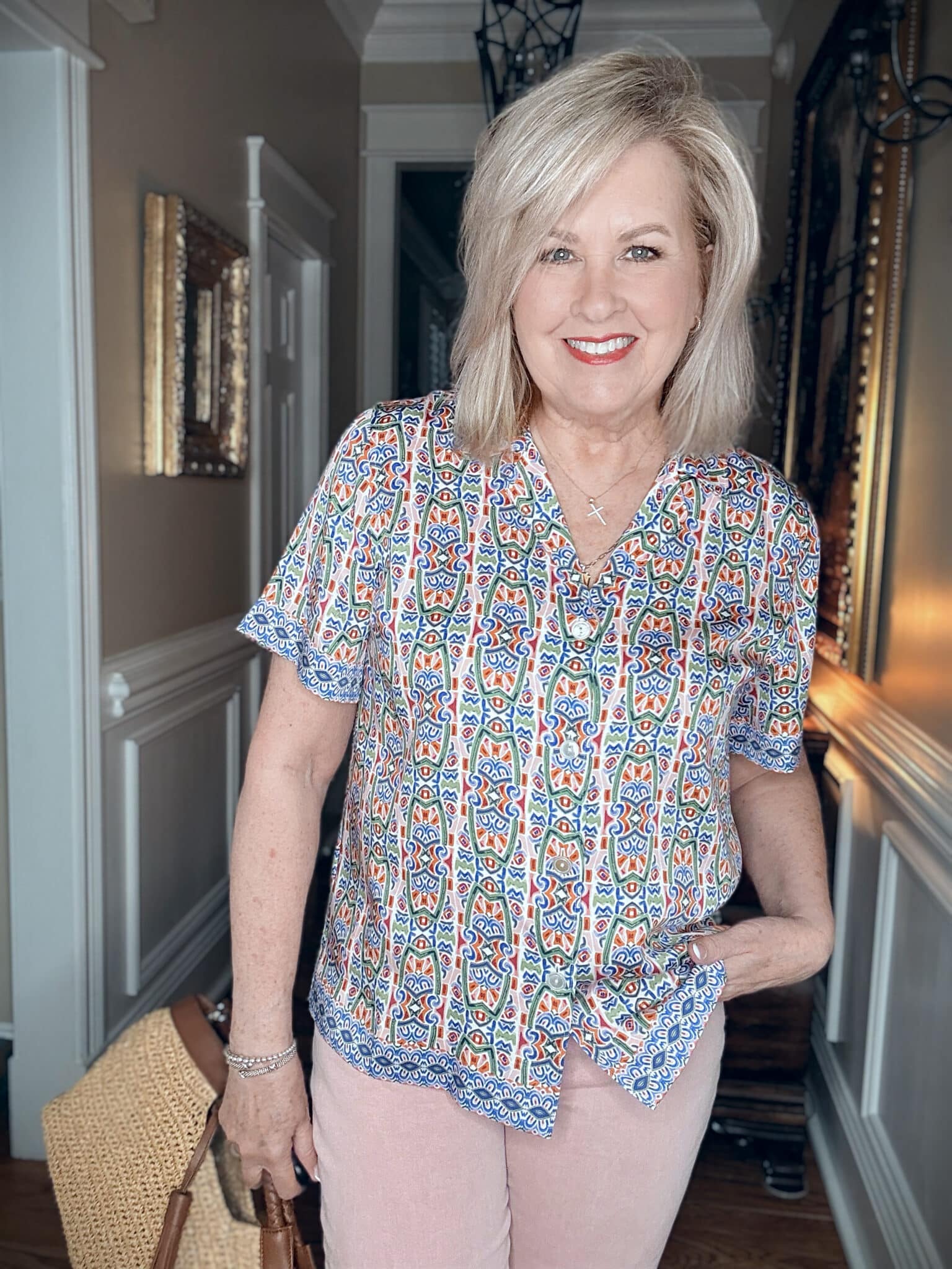 Tania wearing a button-up mosaic camp shirt from Tommy Bahama