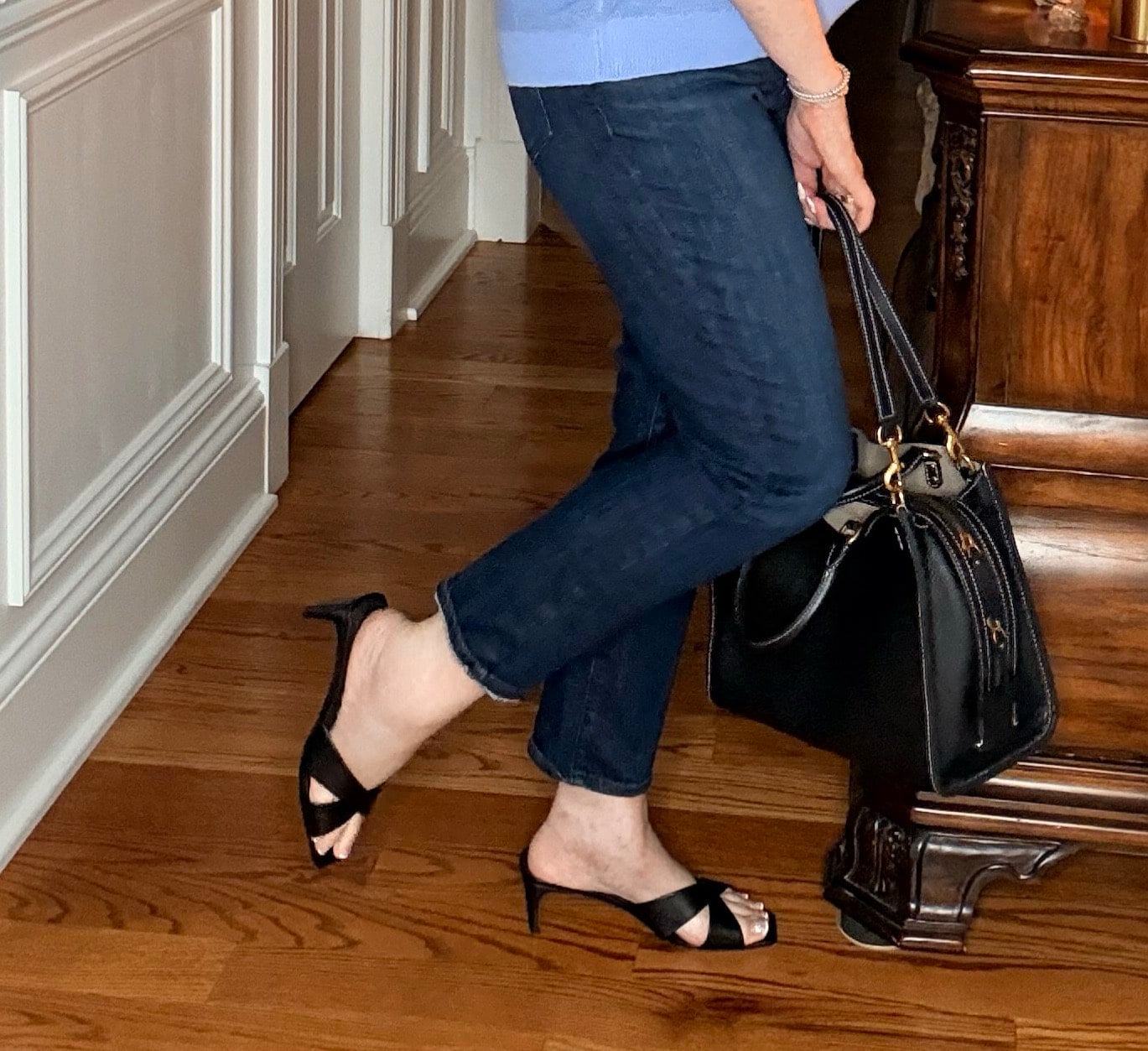 Tania wearing dark wash crop jeans from Frame