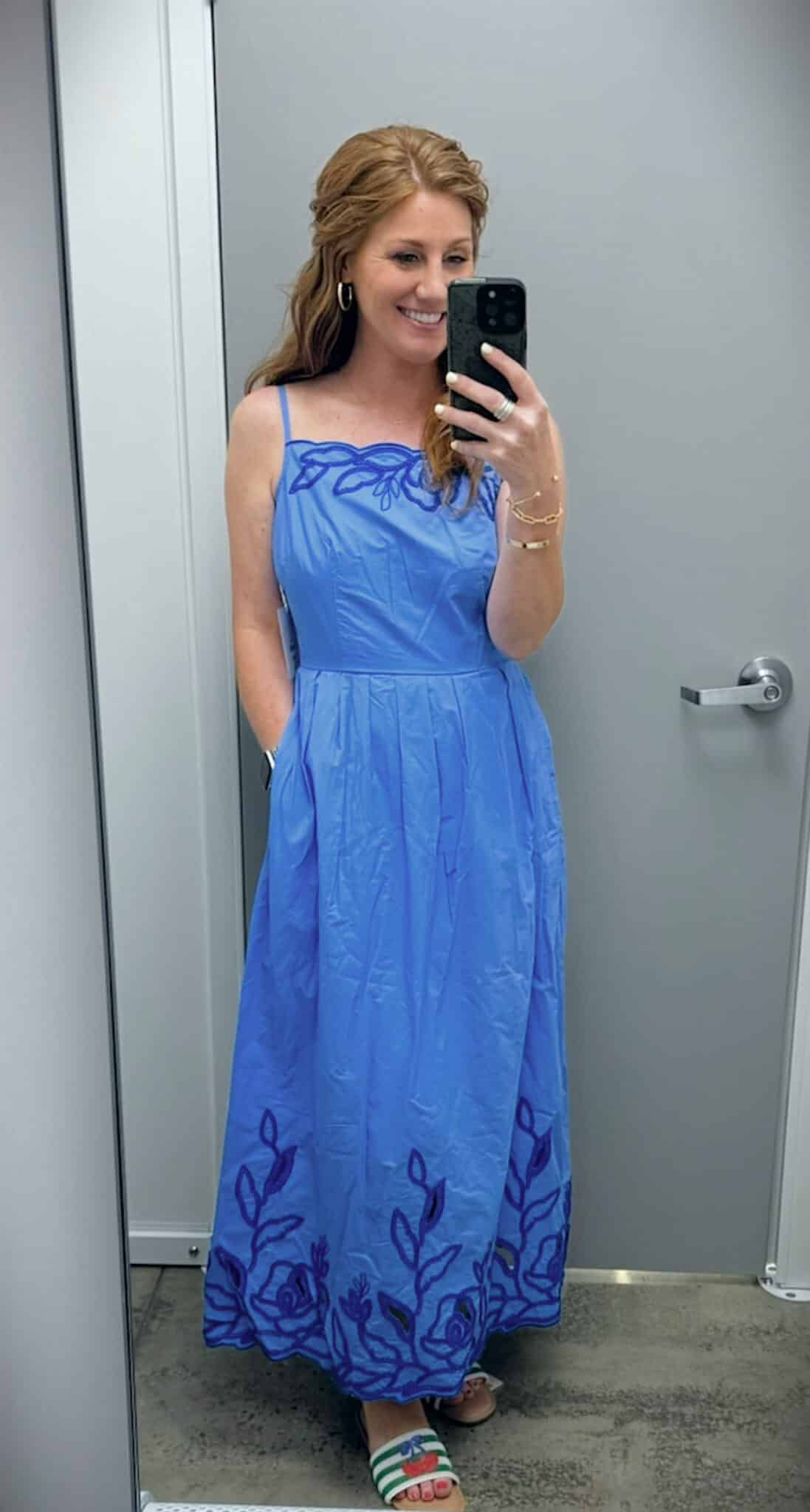 Stephanie wearing a bright blue embroidered cotton midi dress with colorful beaded slide sandals during a Walmart try-on.