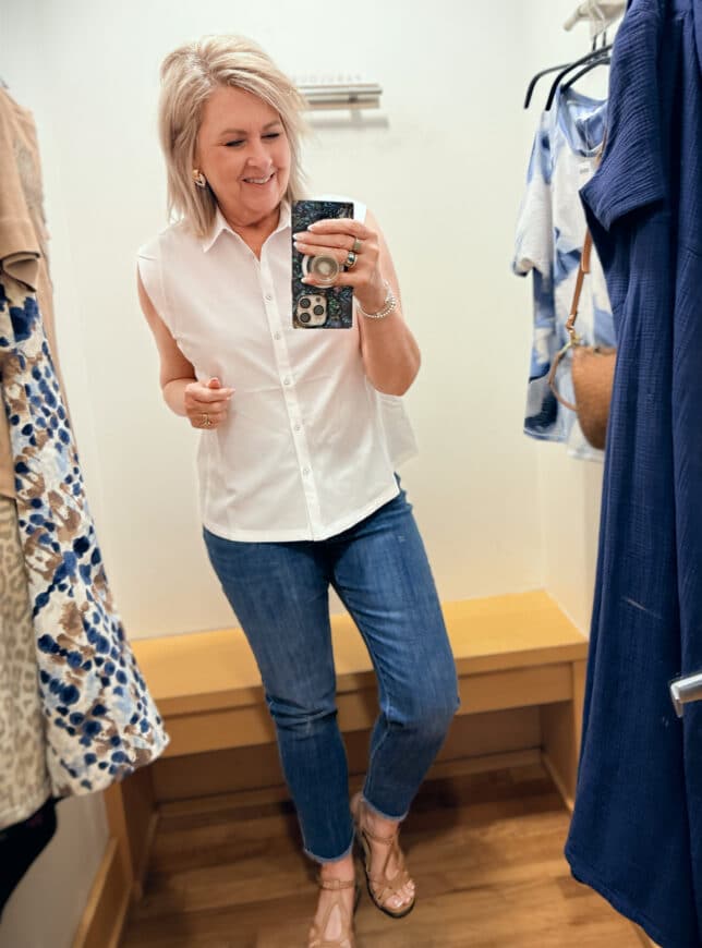 Tania wearing a white sleeveless shirt with girlfriend jeans from Chico's