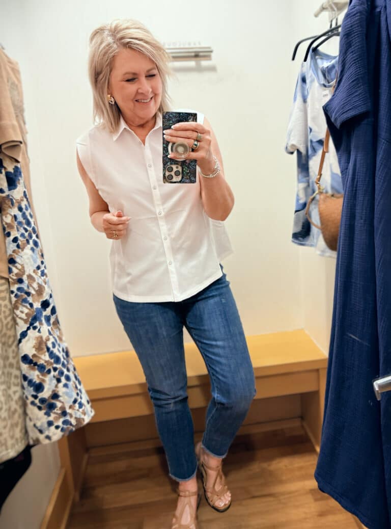 Tania wearing a white sleeveless shirt with girlfriend jeans from Chico's