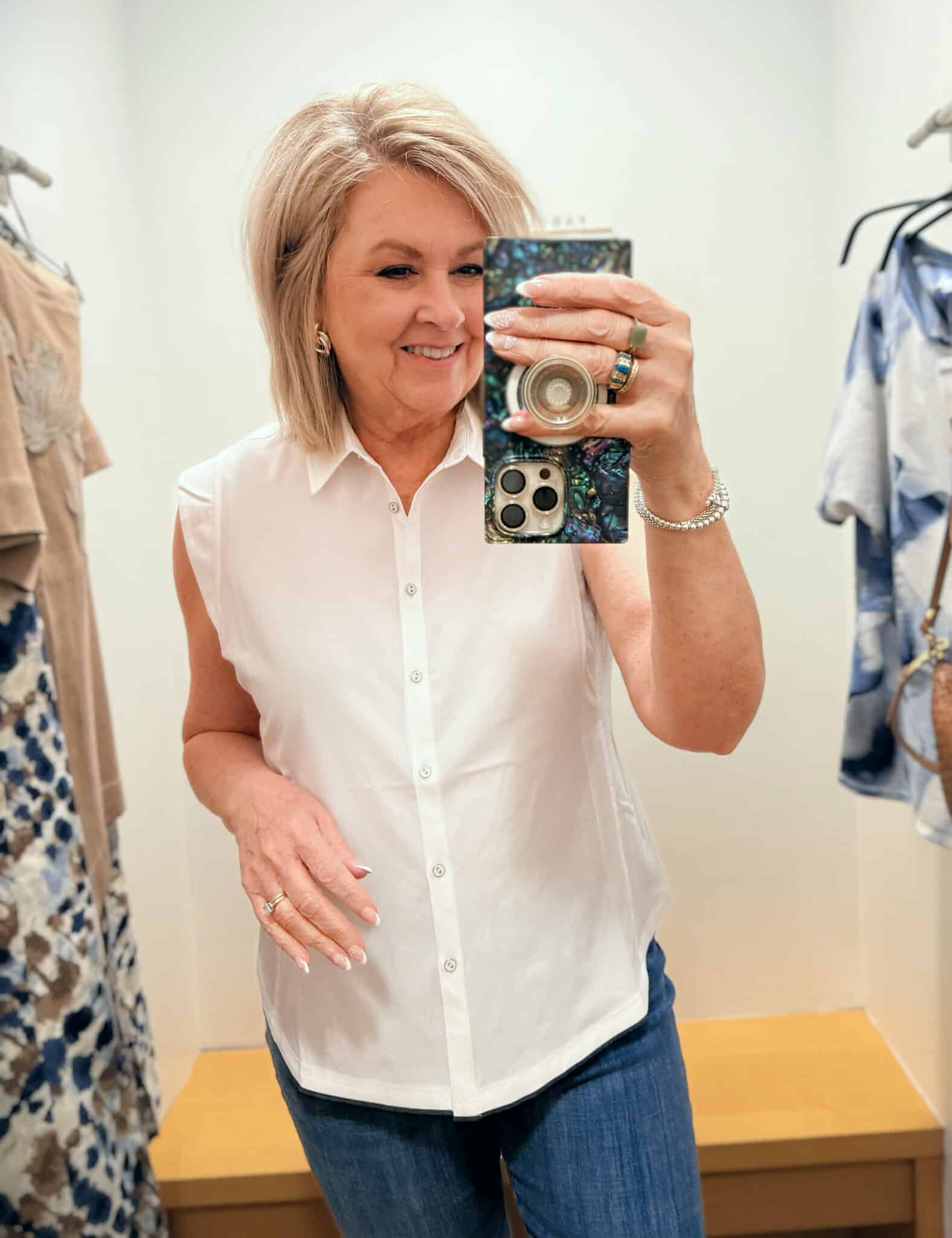 Tania wearing a white sleeveless shirt from Chico's