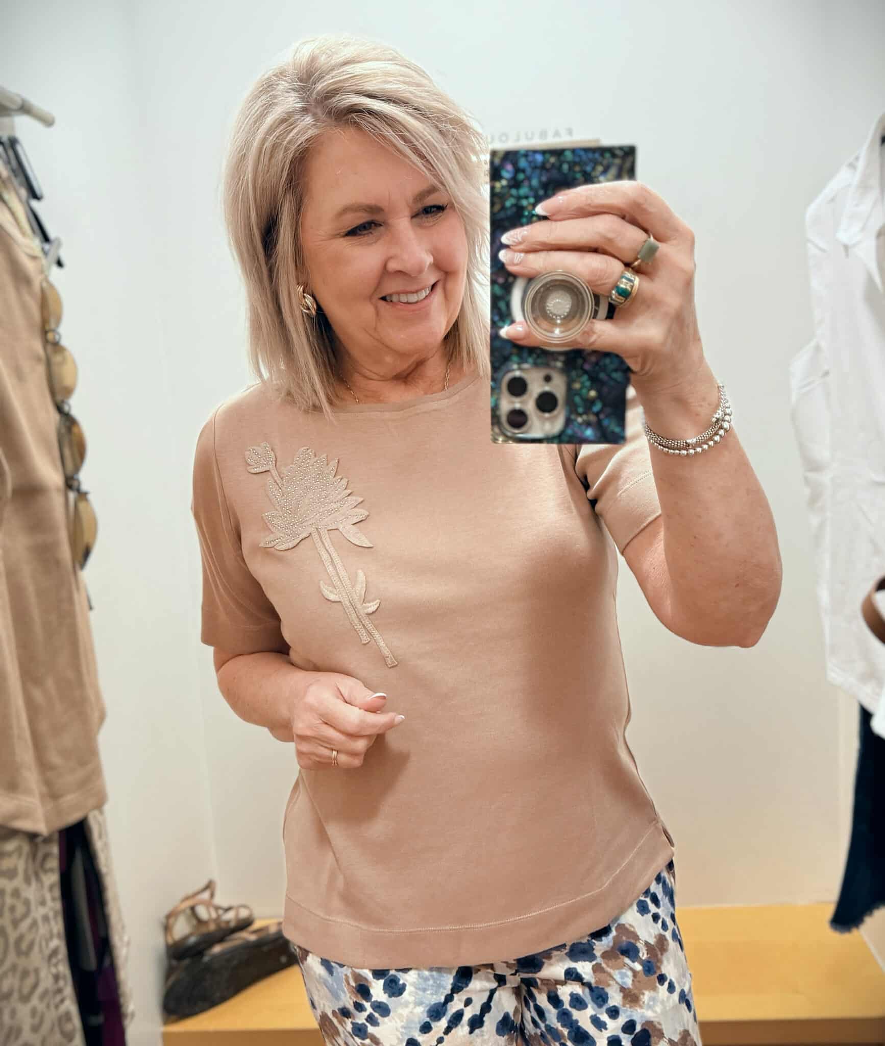 Tania wearing a light brown embellished tee from Chico's