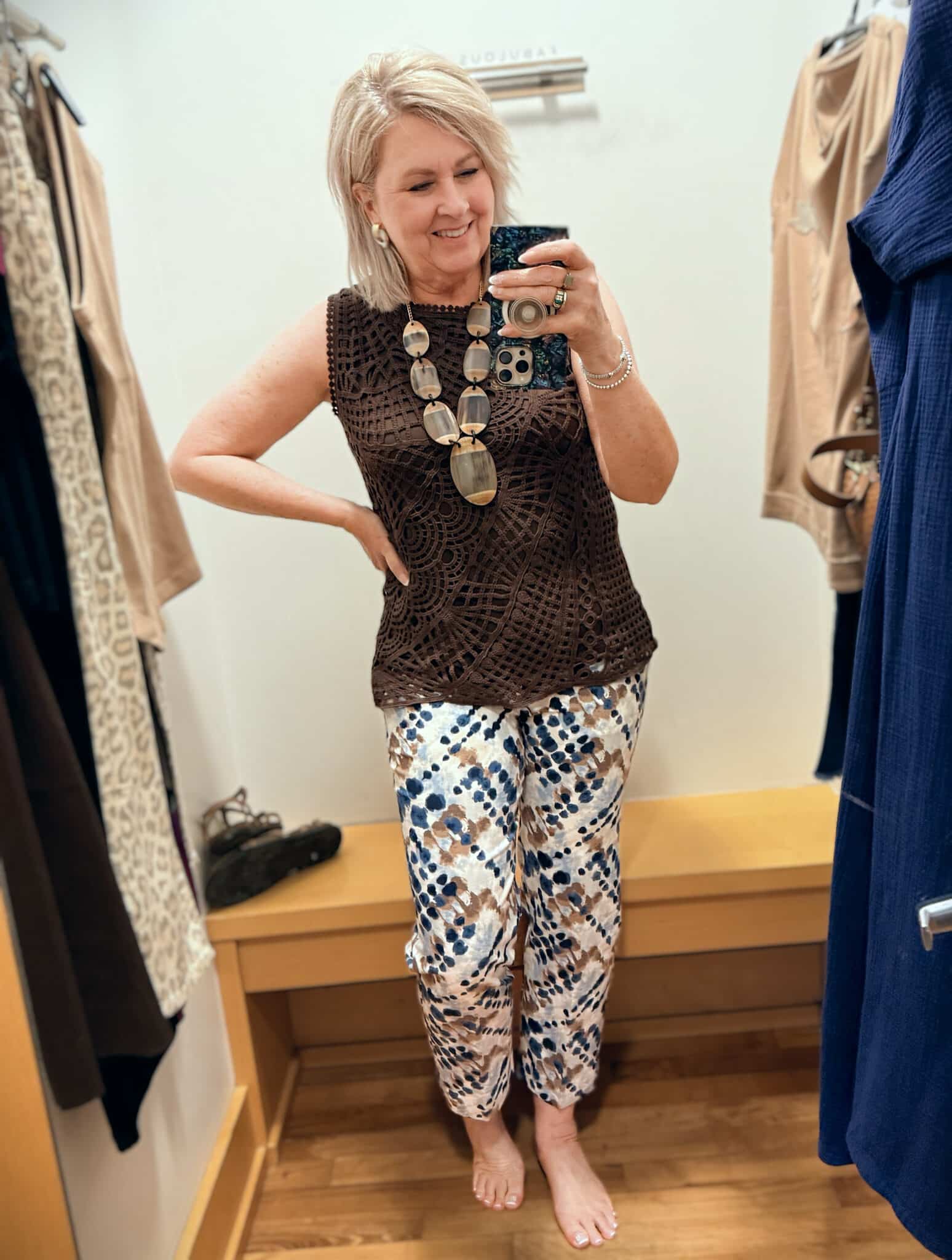 Tania wearing a chocolate brown tank with printed pants from Chico's
