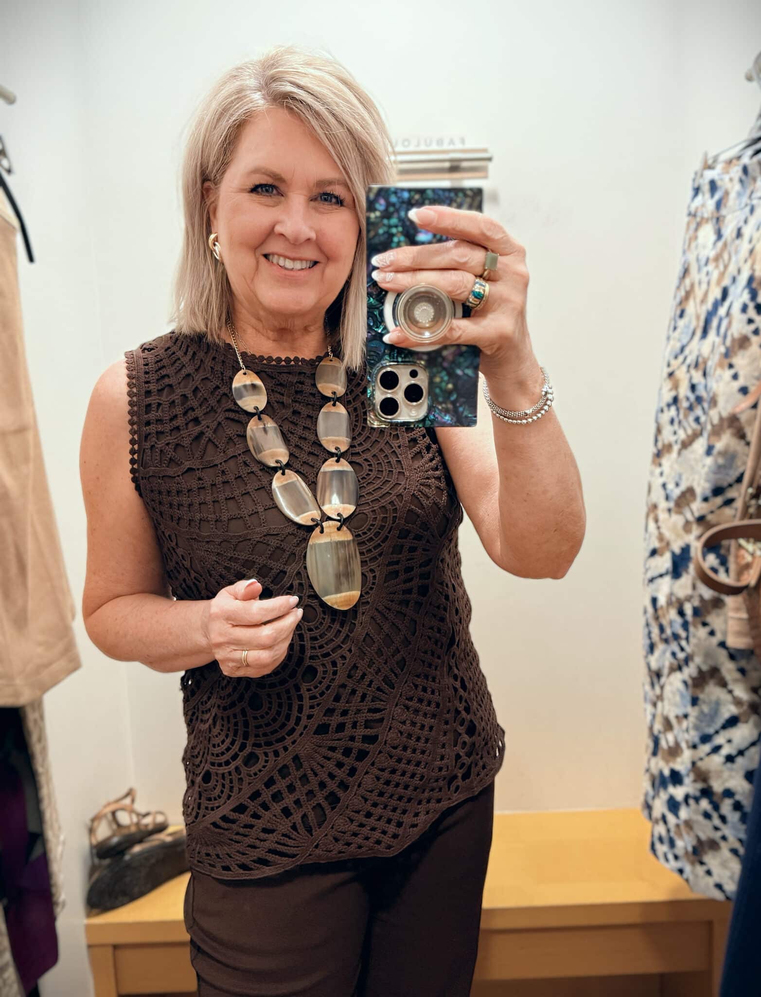 Tania wearing a chocolate brown lace tank from Chico's