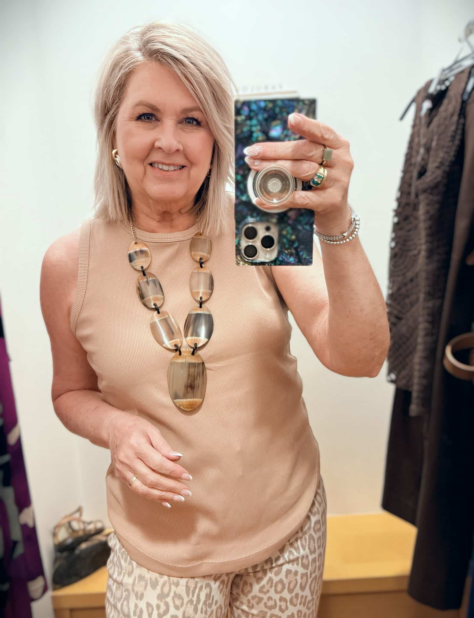 Tania wearing a tan ribbed tank from Chico's
