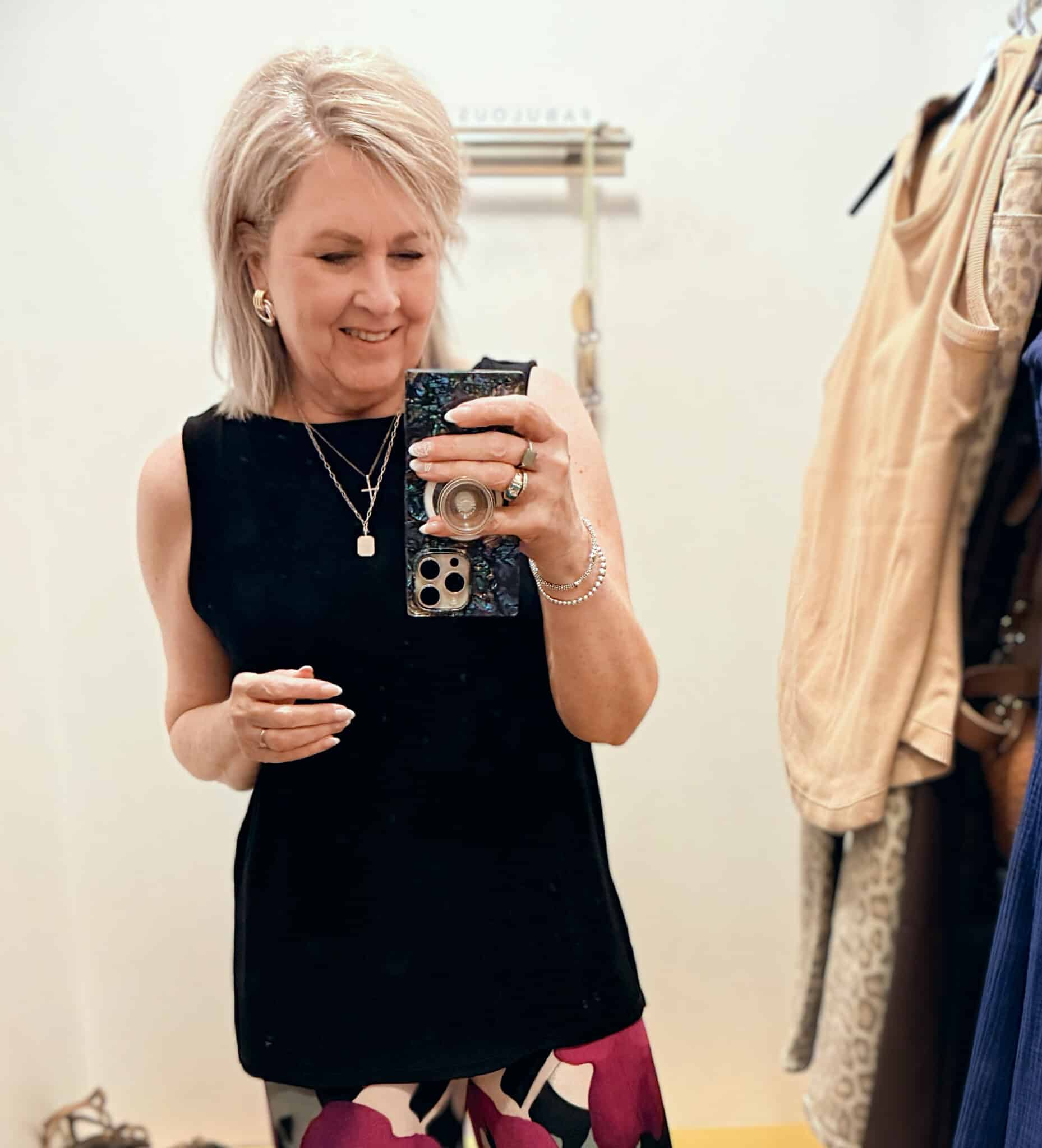 Tania wearing a black tunic tank from the Zenergy line at Chico's