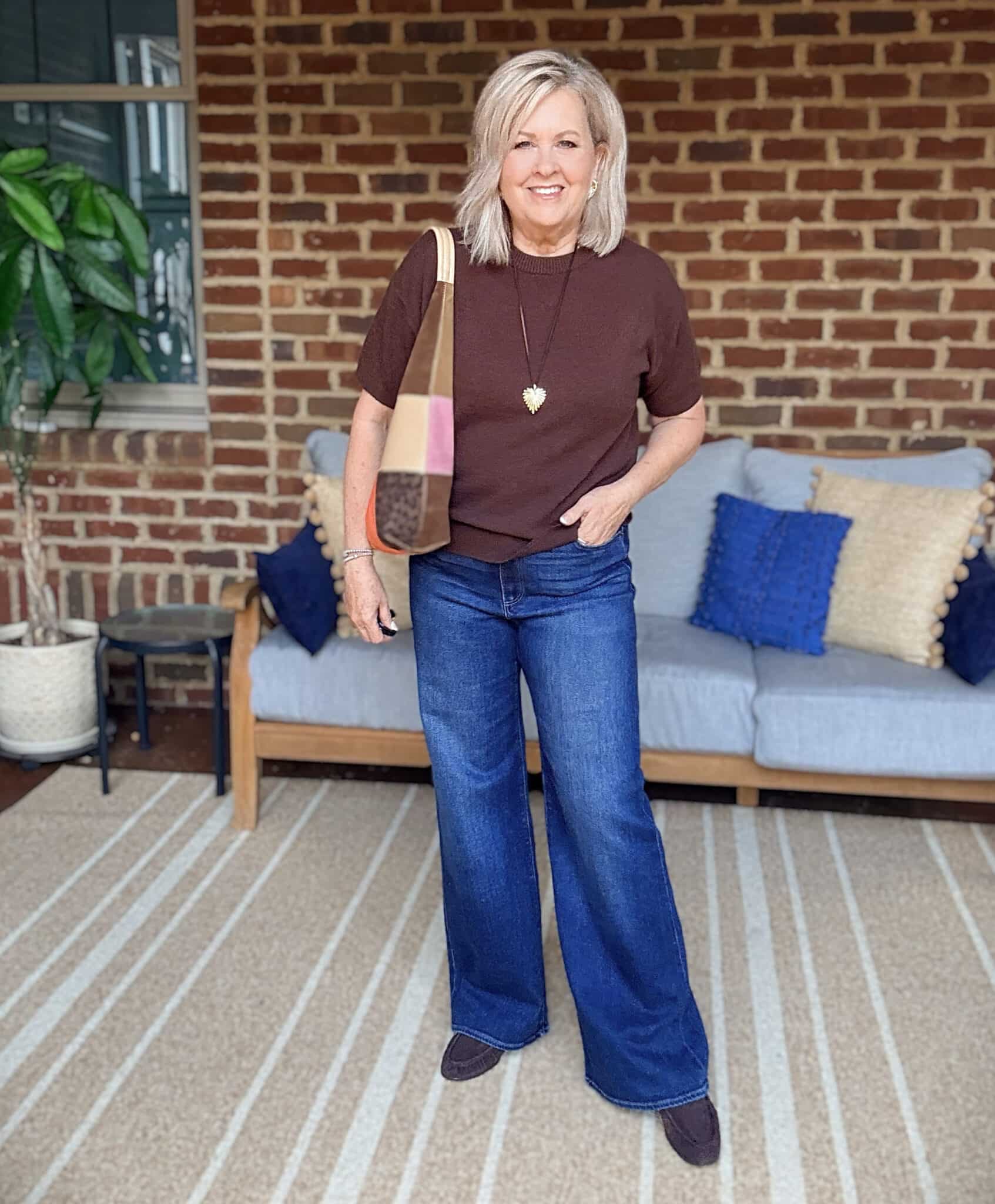 Tania wearing a chocolate brown cashmere tee with Paige wide-leg jeans from Nordstrom