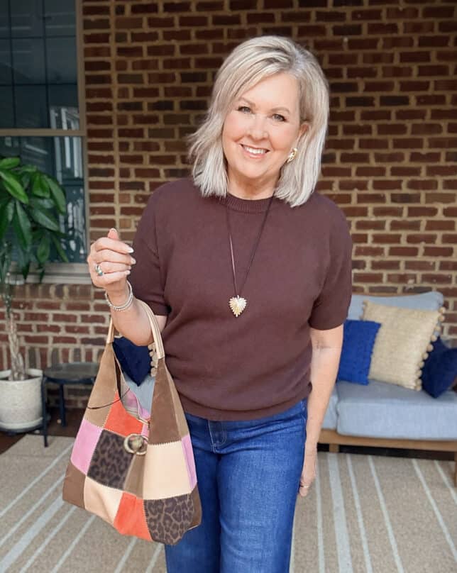 Tania wearing a chocolate brown cashmere tee with a patchwork handbag from Nordstrom