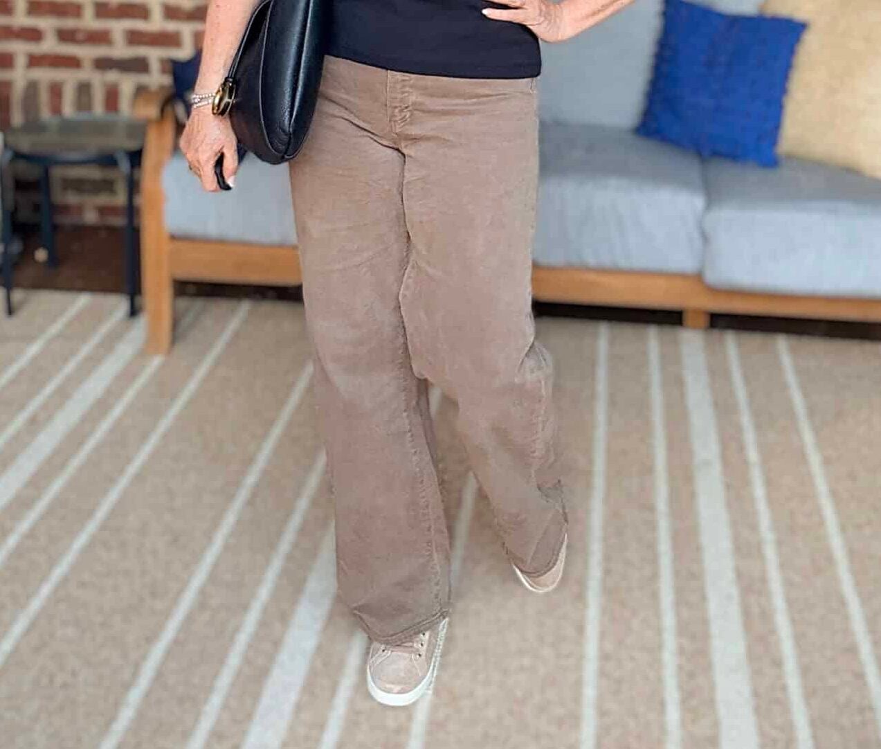 Tania wearing Paige brown wide-leg jeans from Nordstrom