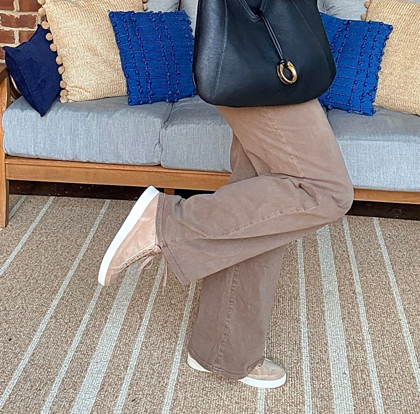 Tania wearing Paige brown wide-leg jeans with Vionic neutral sneakers from Nordstrom