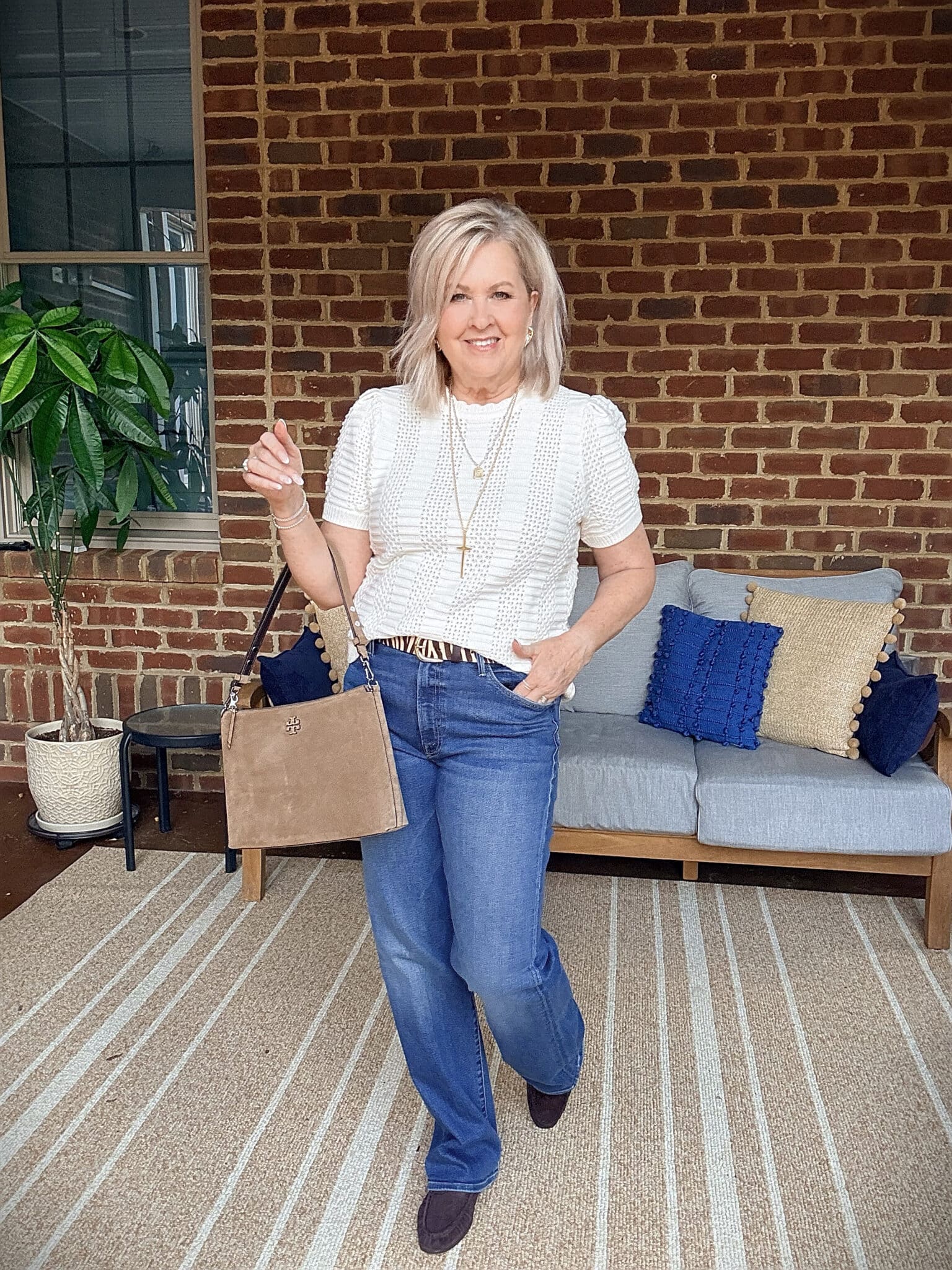 Tania wearing a white crochet tee with Mother wide-leg jeans from Nordstrom