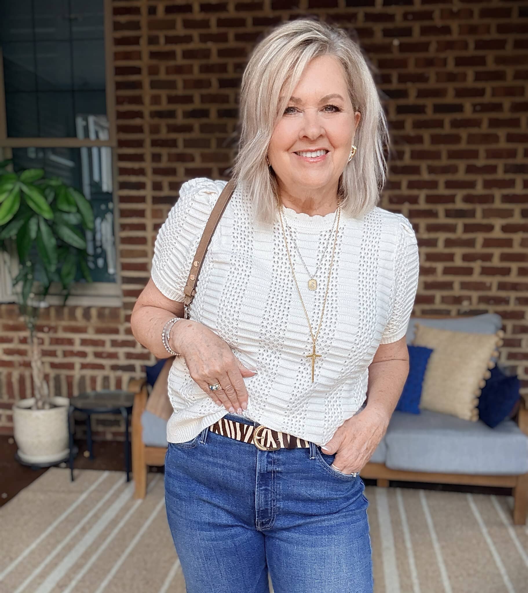 Tania wearing Mother wide-leg jeans with a zebra print belt from Nordstrom