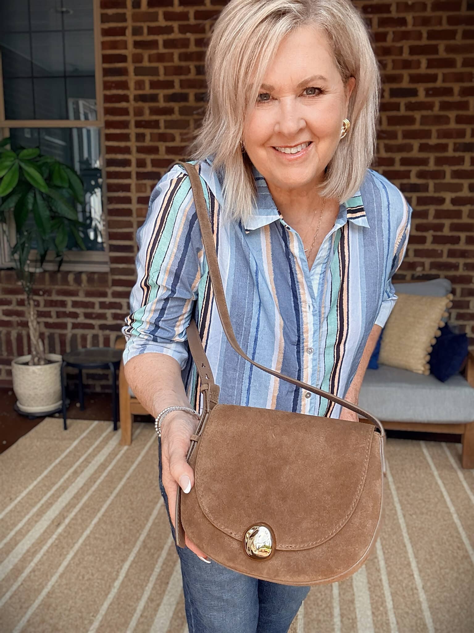 Tania holding a brown Madewell handbag from Nordstrom