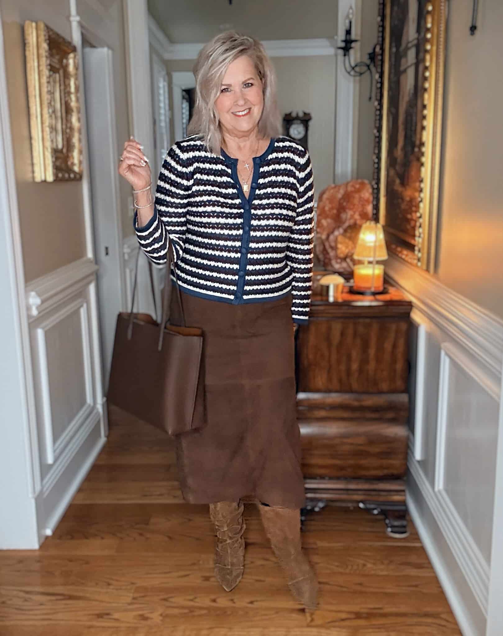 Tania wearing a brown suede midi skirt with Ash scrunch boots from Nordstrom