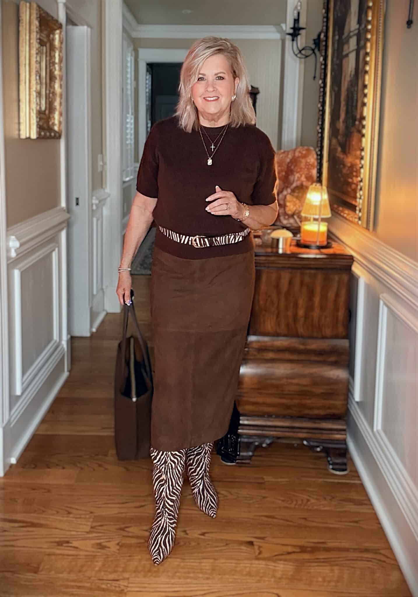 Tania wearing a brown cashmere sweater with a suede midi skirt with Zebra/Tiger print knee boots from Nordstrom
