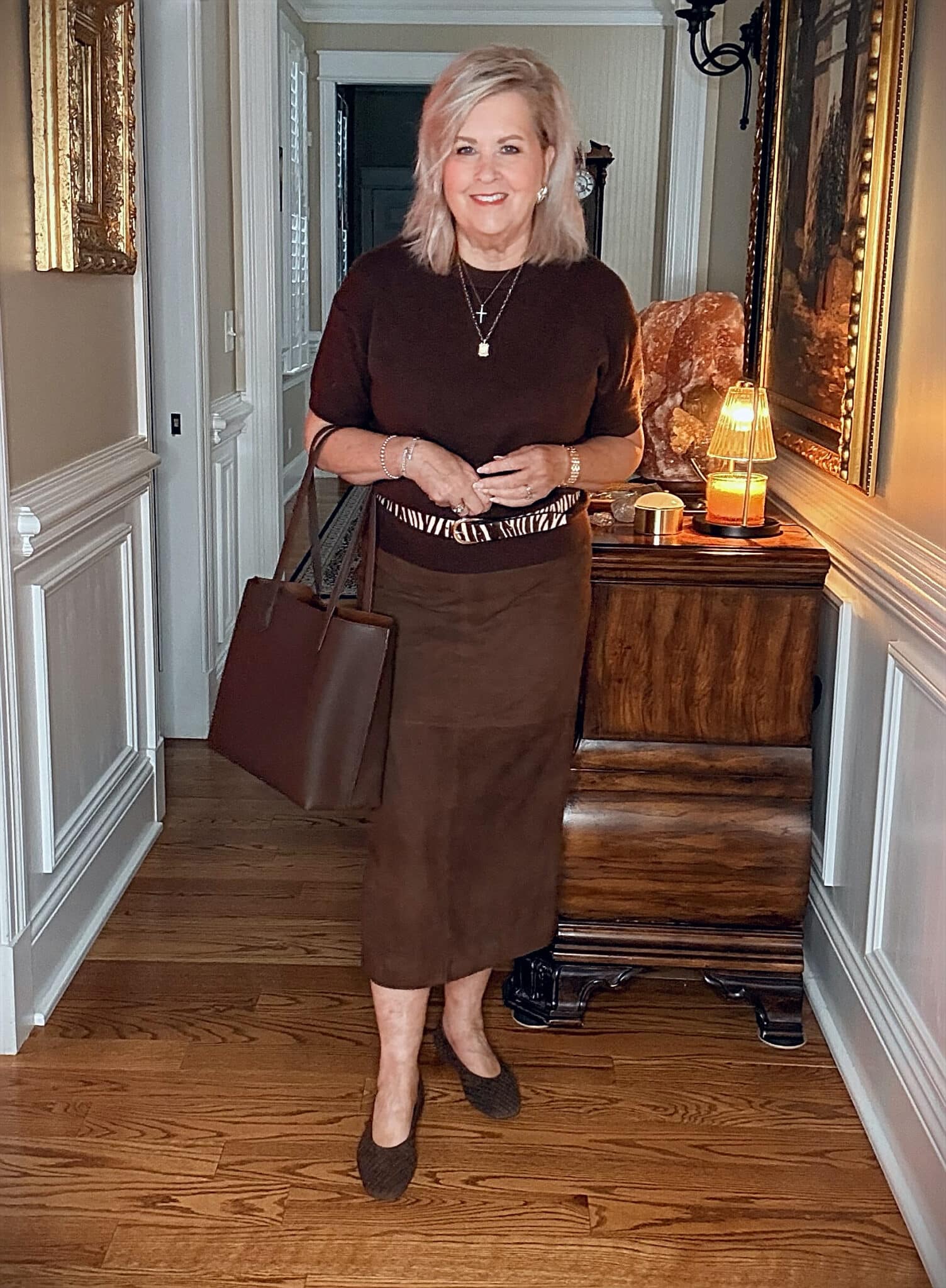 Tania wearing a brown cashmere sweater with a suede midi skirt with chocolate brown woven flats from Nordstrom