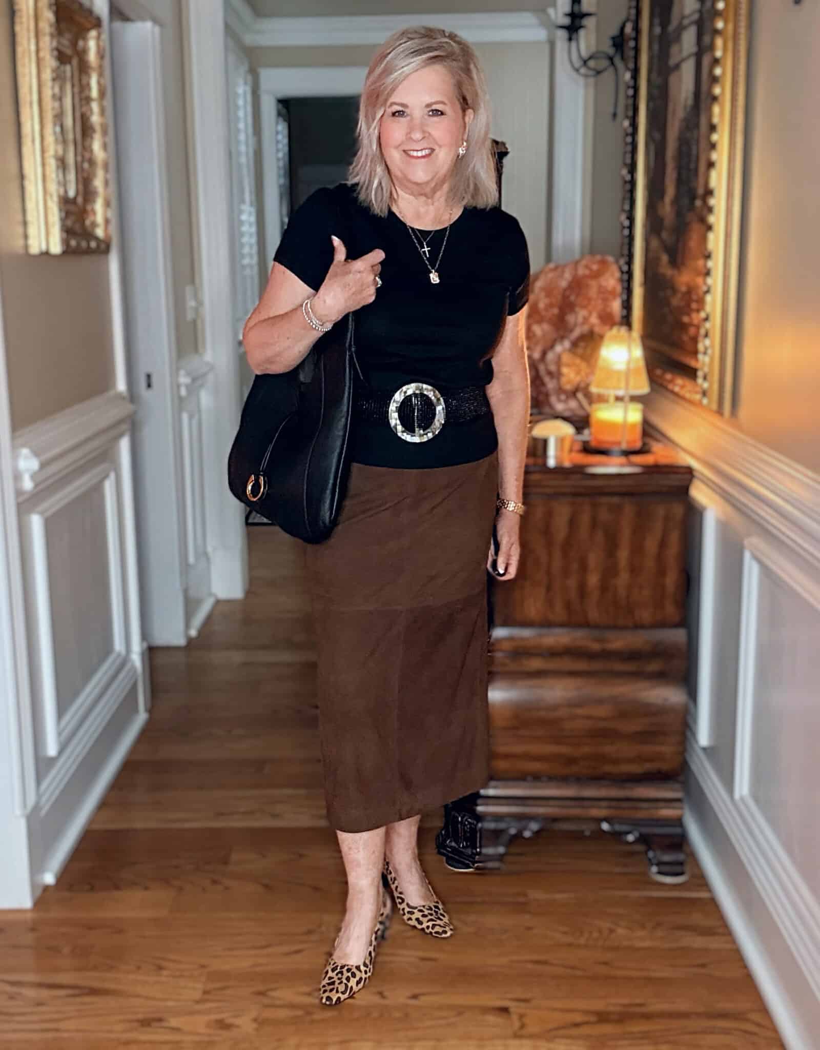Tania wearing a black t-shirt with a suede midi skirt with leopard print slingback shoes from Nordstrom