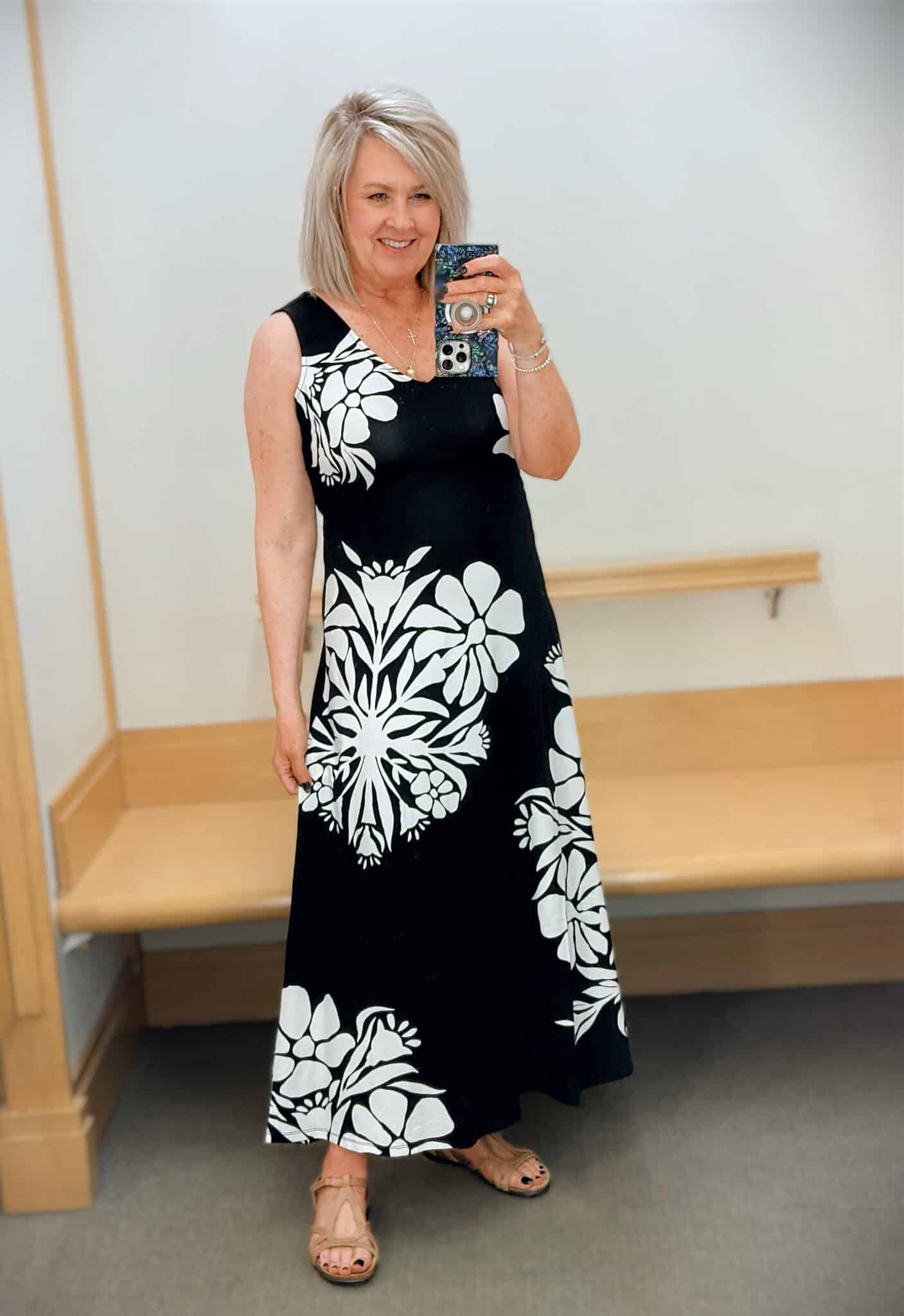 Tania wearing a black maxi with large white flowers
