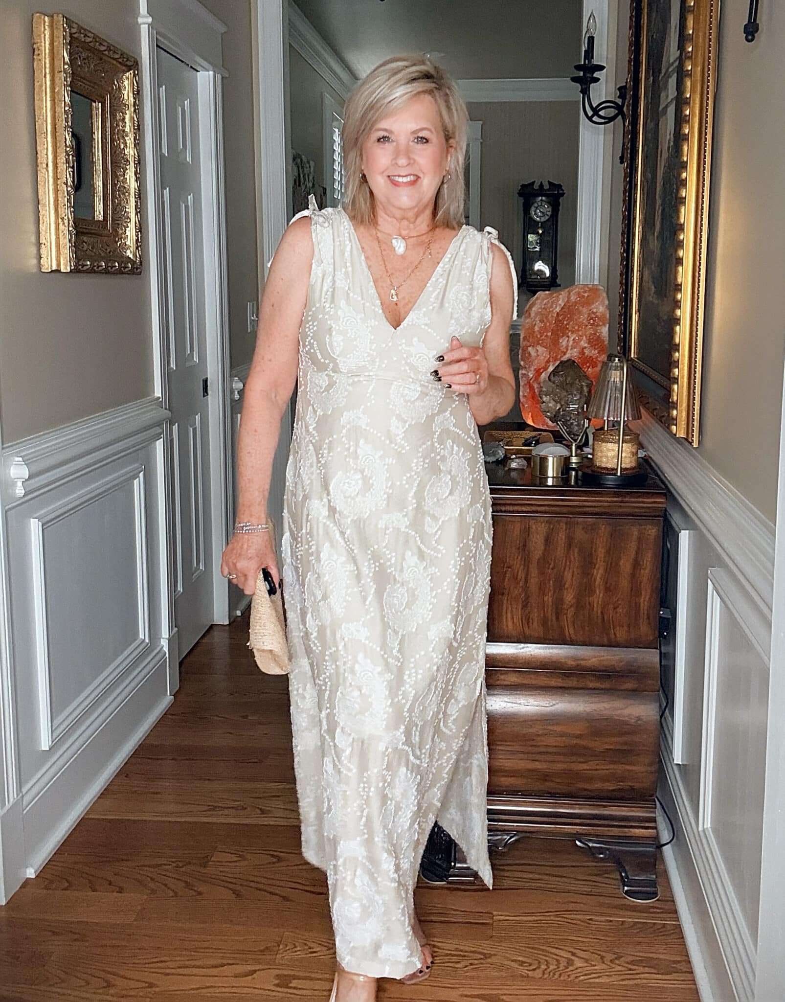 Tania wearing a champagne dress with embroidery