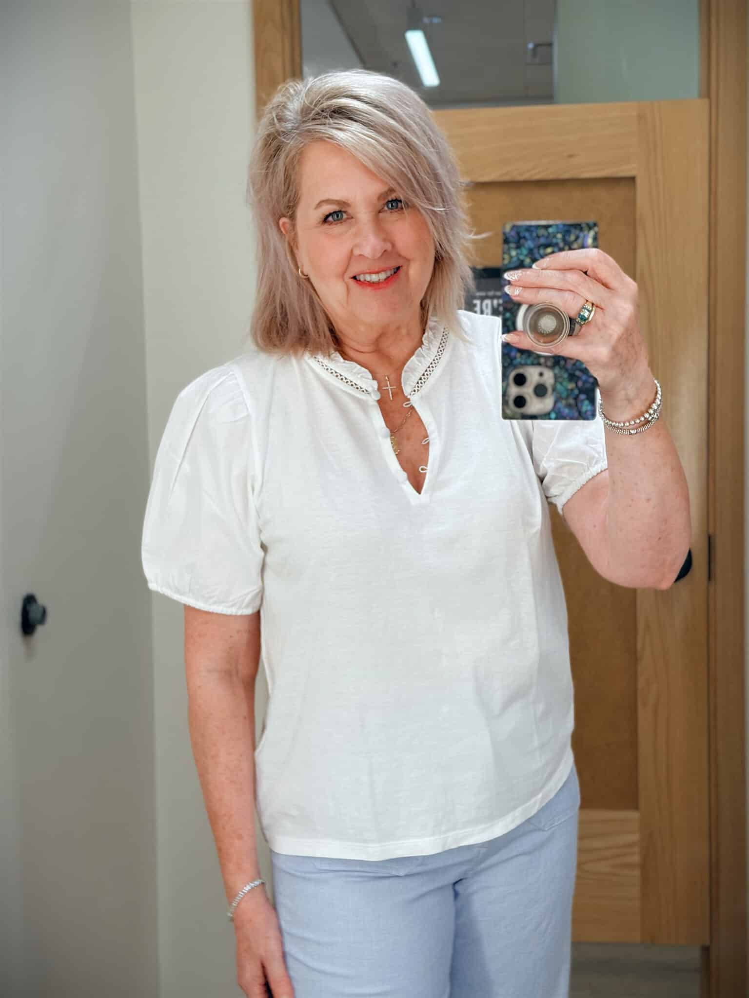 Tania wearing a white puff sleeve top from J.Crew Factory
