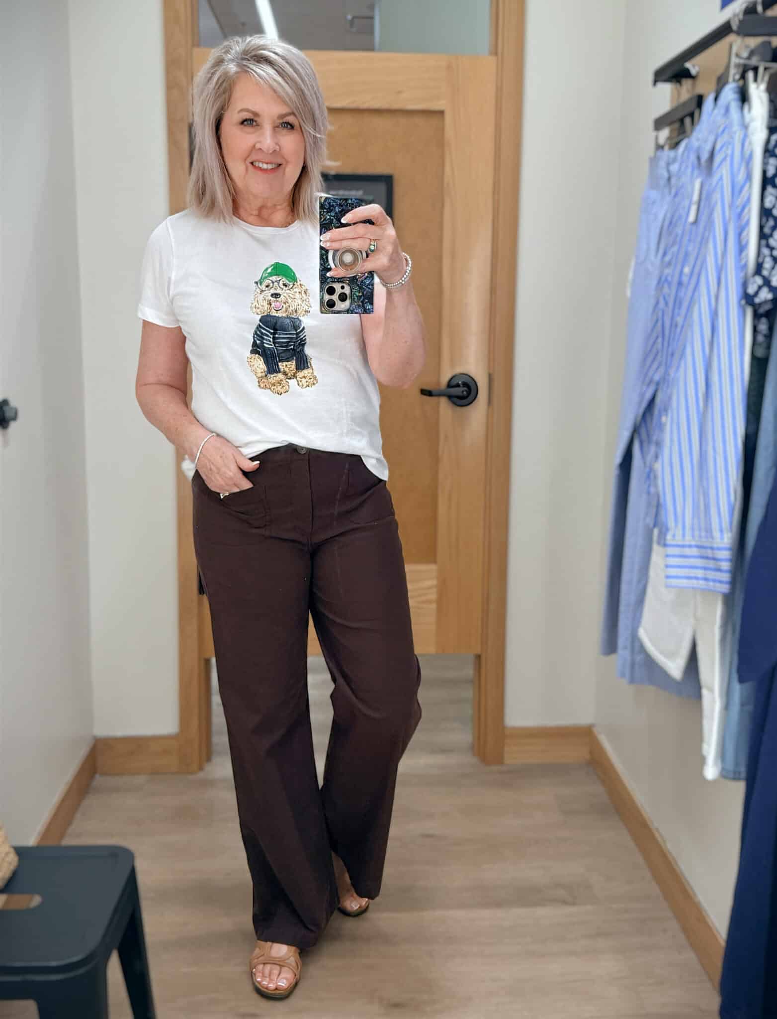 Tania wearing a cute dog graphic tee with chocolate brown pants from J.Crew Factory