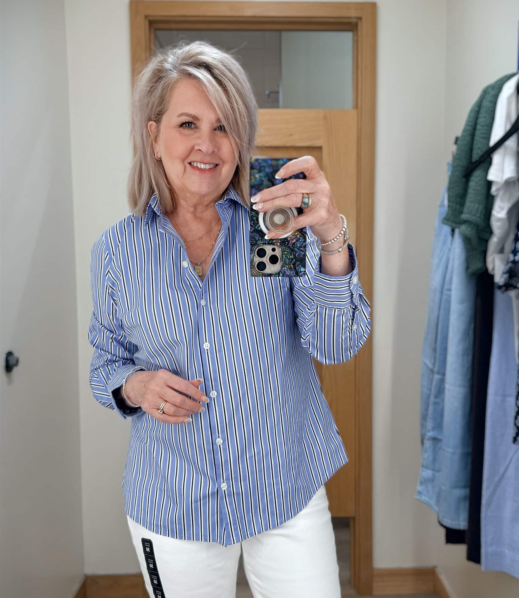Tania wearing a blue striped shirt from J.Crew Factory