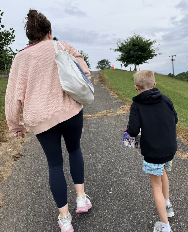 Ashleigh and Beckham walking up the hill to a park