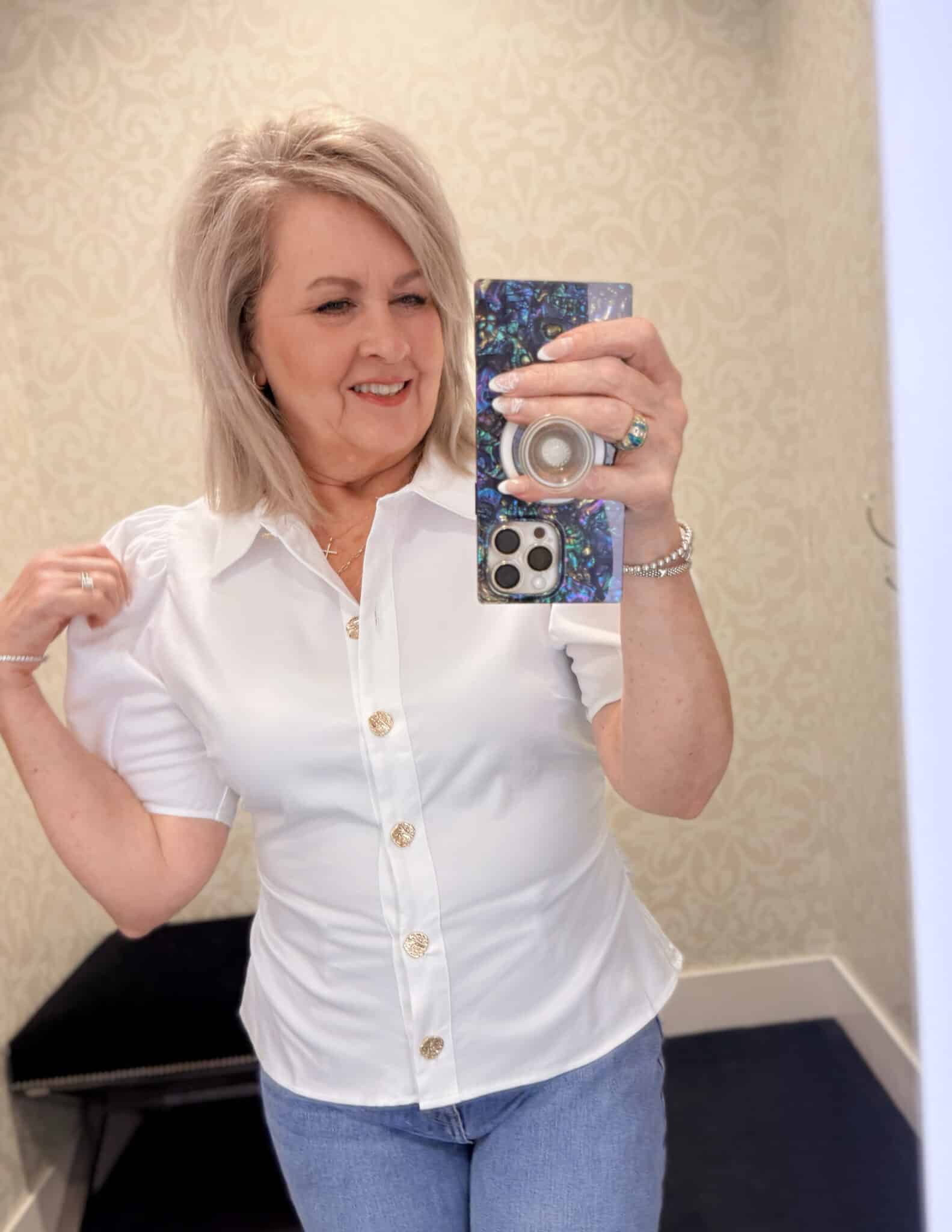 Tania wearing a white puff sleeve top from White House Black Market