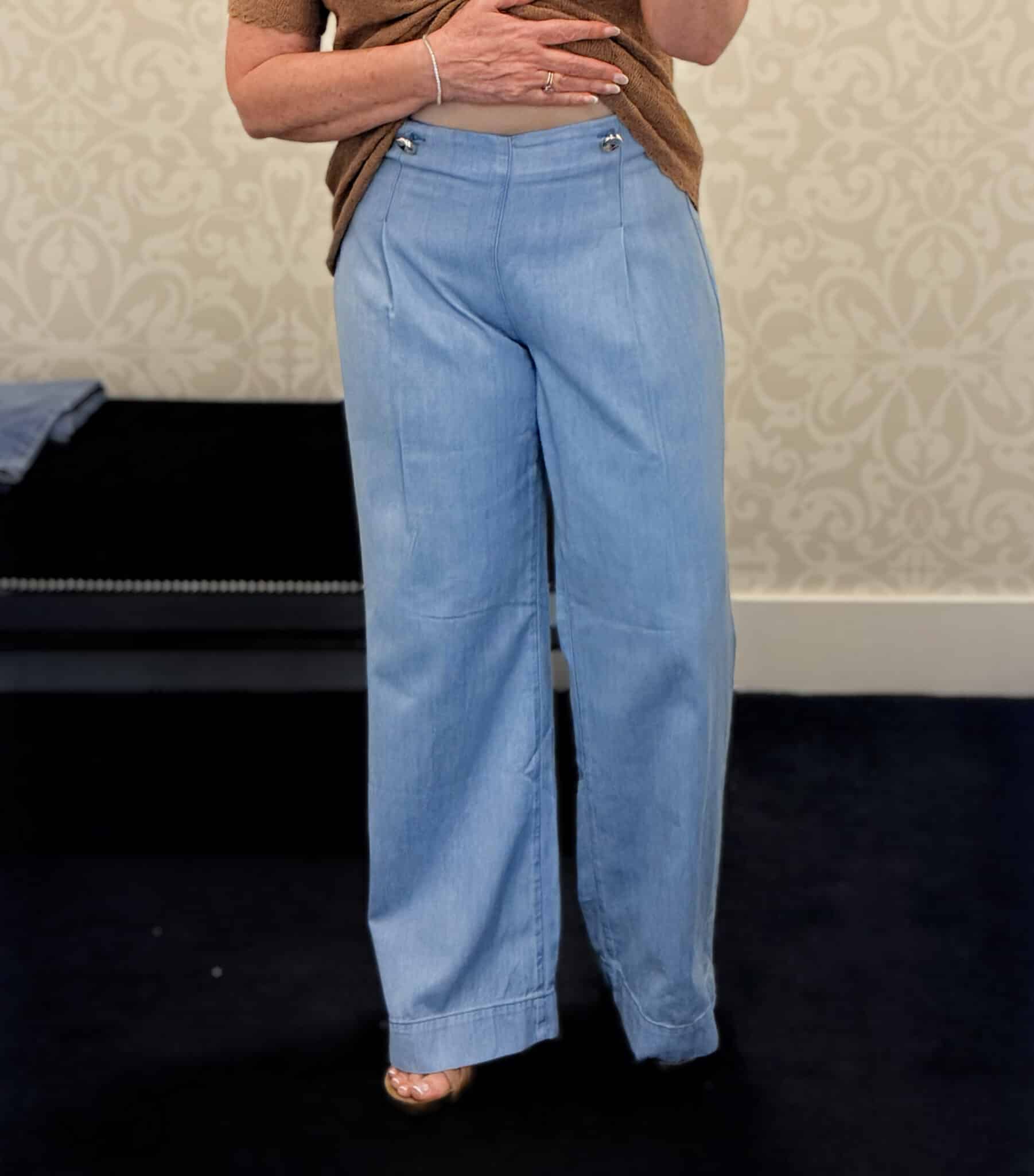 Tania wearing a light wash sailor style jeans from White House Black Market