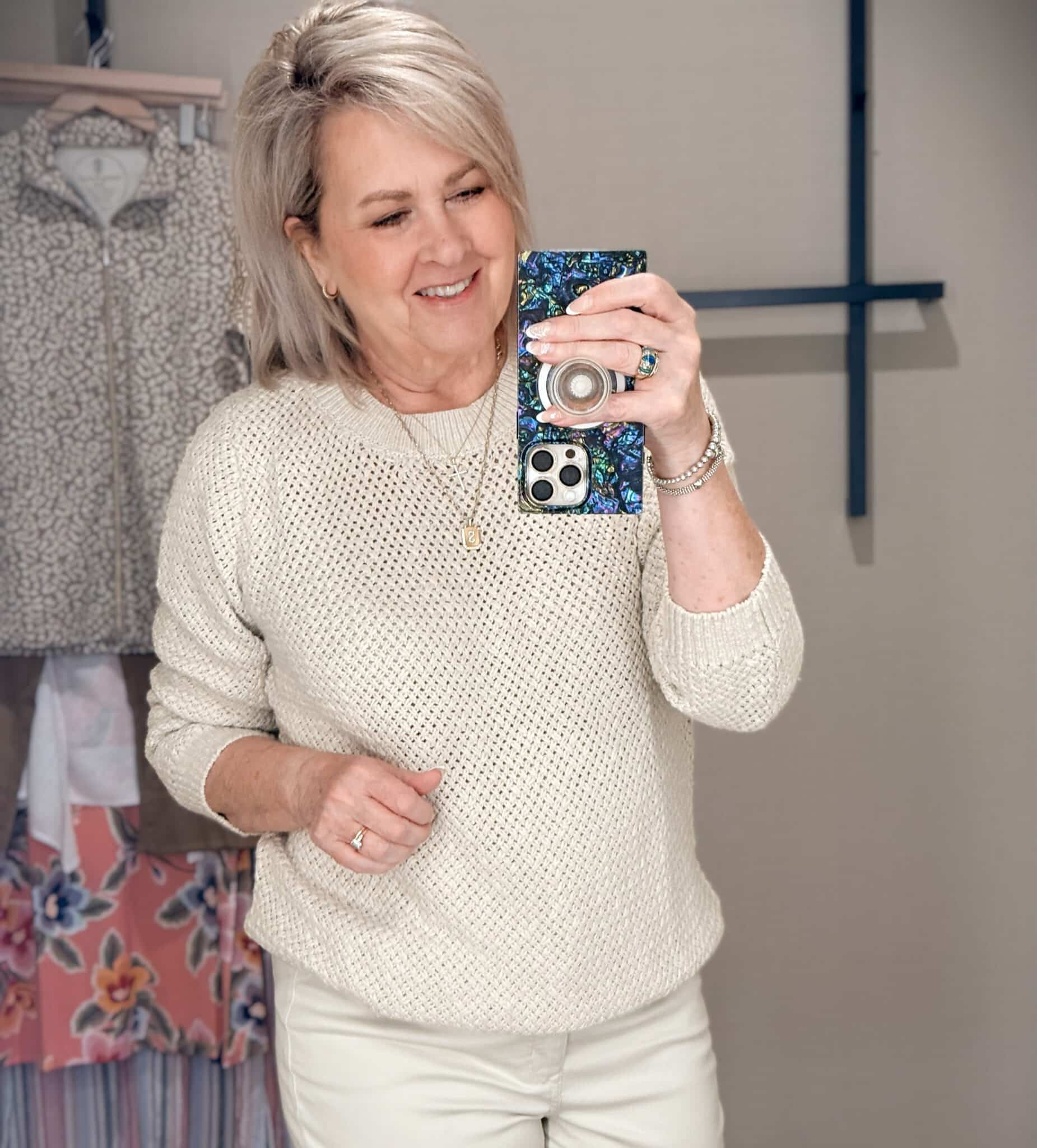 Tania wearing a beige beach sweater from Tommy Bahama for fall transition