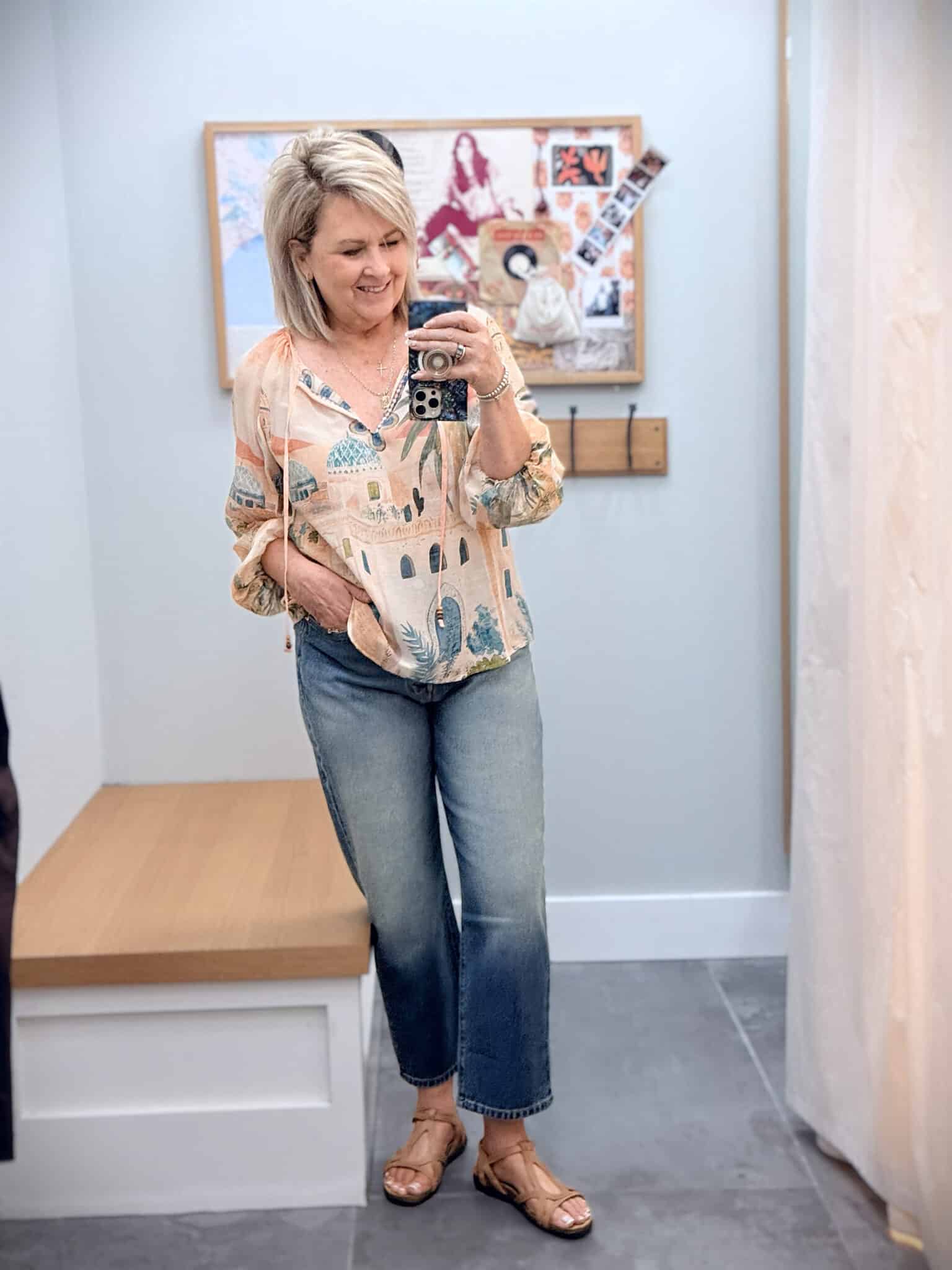 Tania wearing a Peachy Johnny Was top with barrel leg jeans for fall transtion