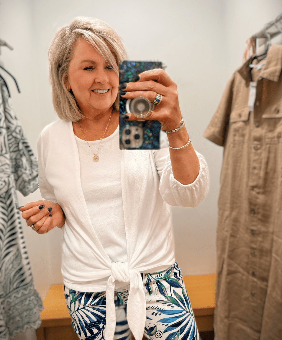 Tania Wearing a white tie cardigan and white tank top from Chico's