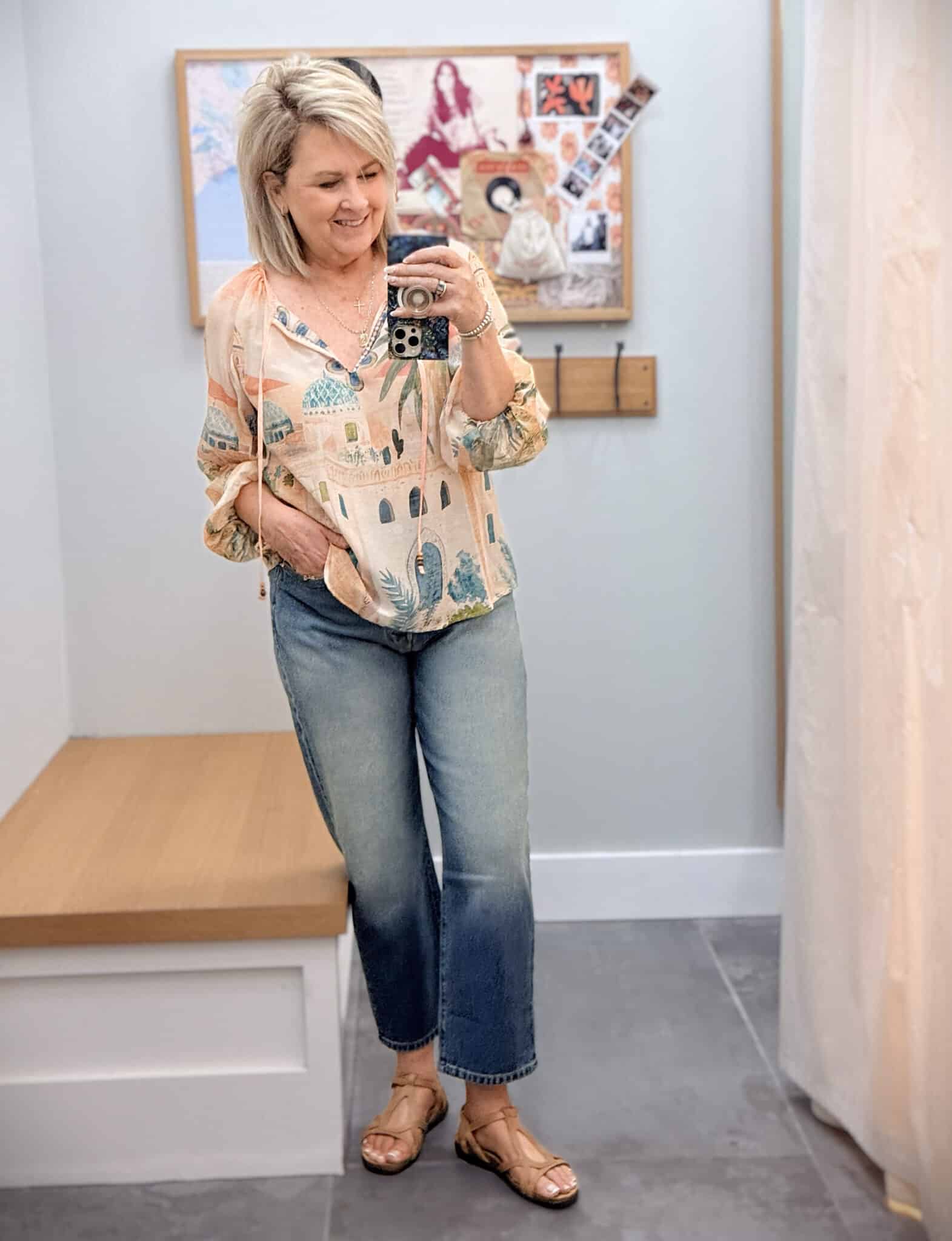 Tania wearing a Johnny Was lightweight printed top with barrel leg jeans