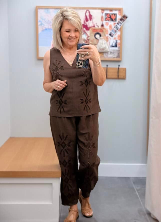 Tania wearing a Johnny Was chocilate brown eyelet V-neck shell with matching brown pants