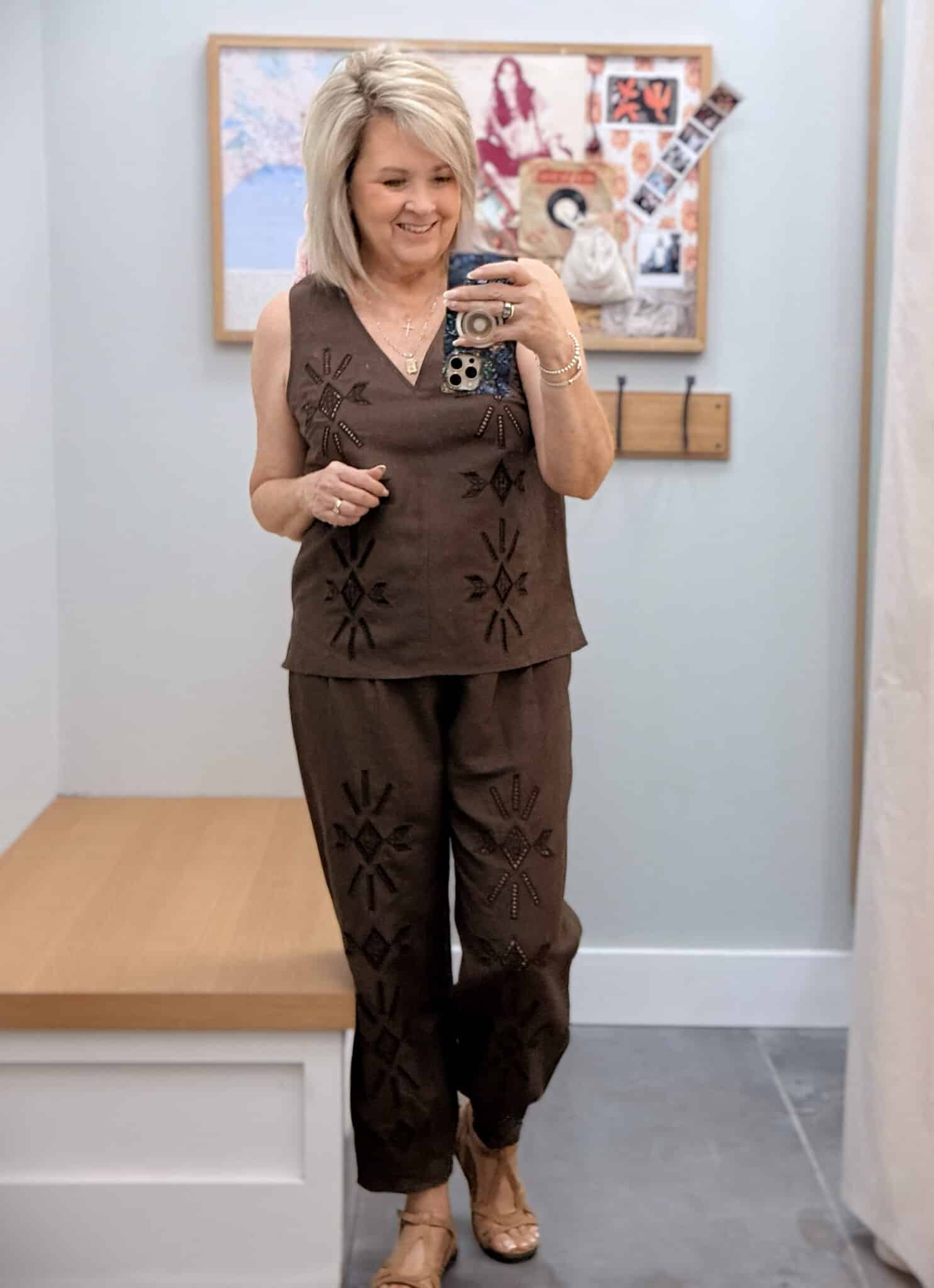 Tania wearing a Johnny Was chocolate brown eyelet V-neck shell with matching brown pants