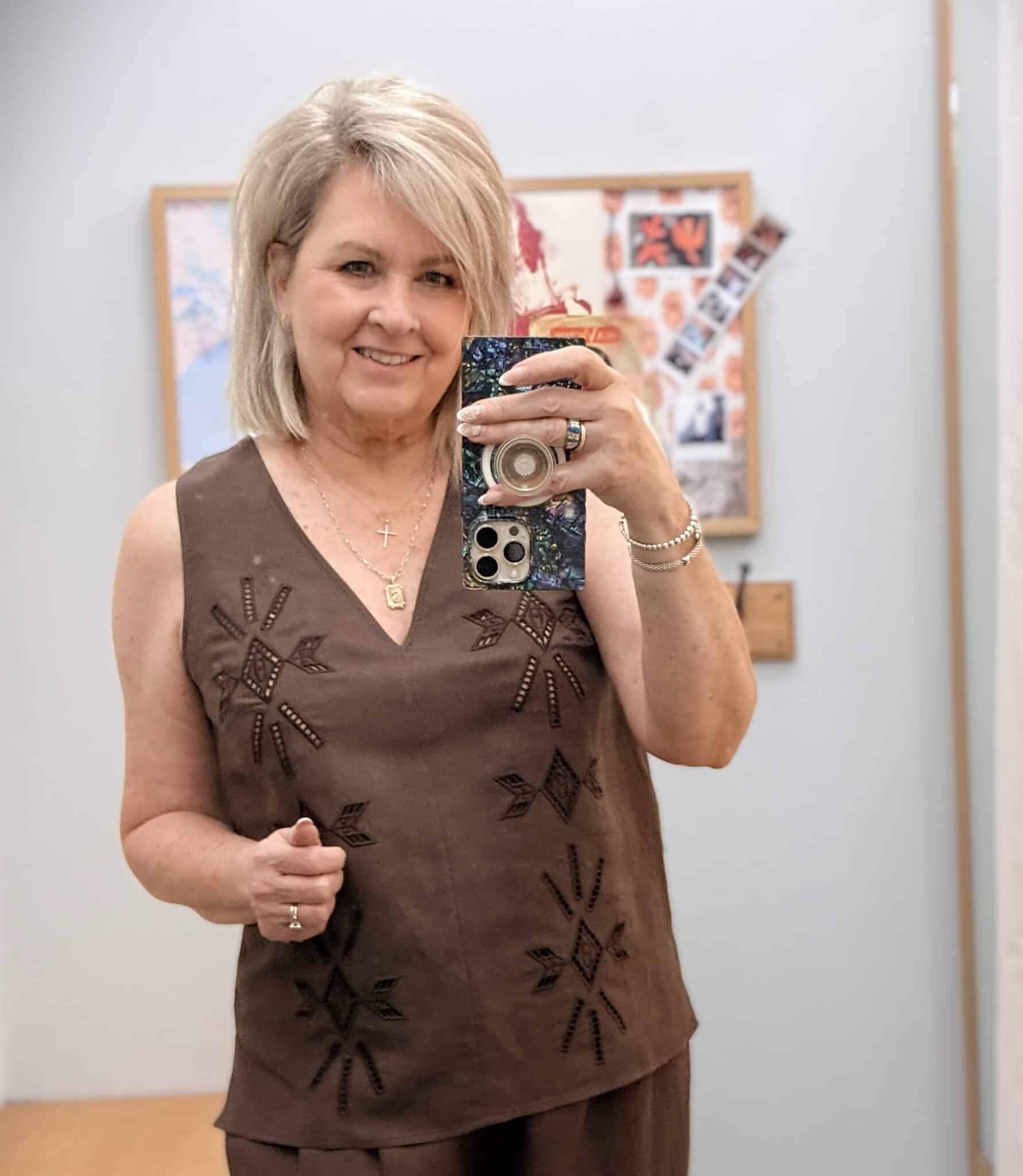 Tania wearing a Johnny Was chocolate brown eyelet V-neck shell