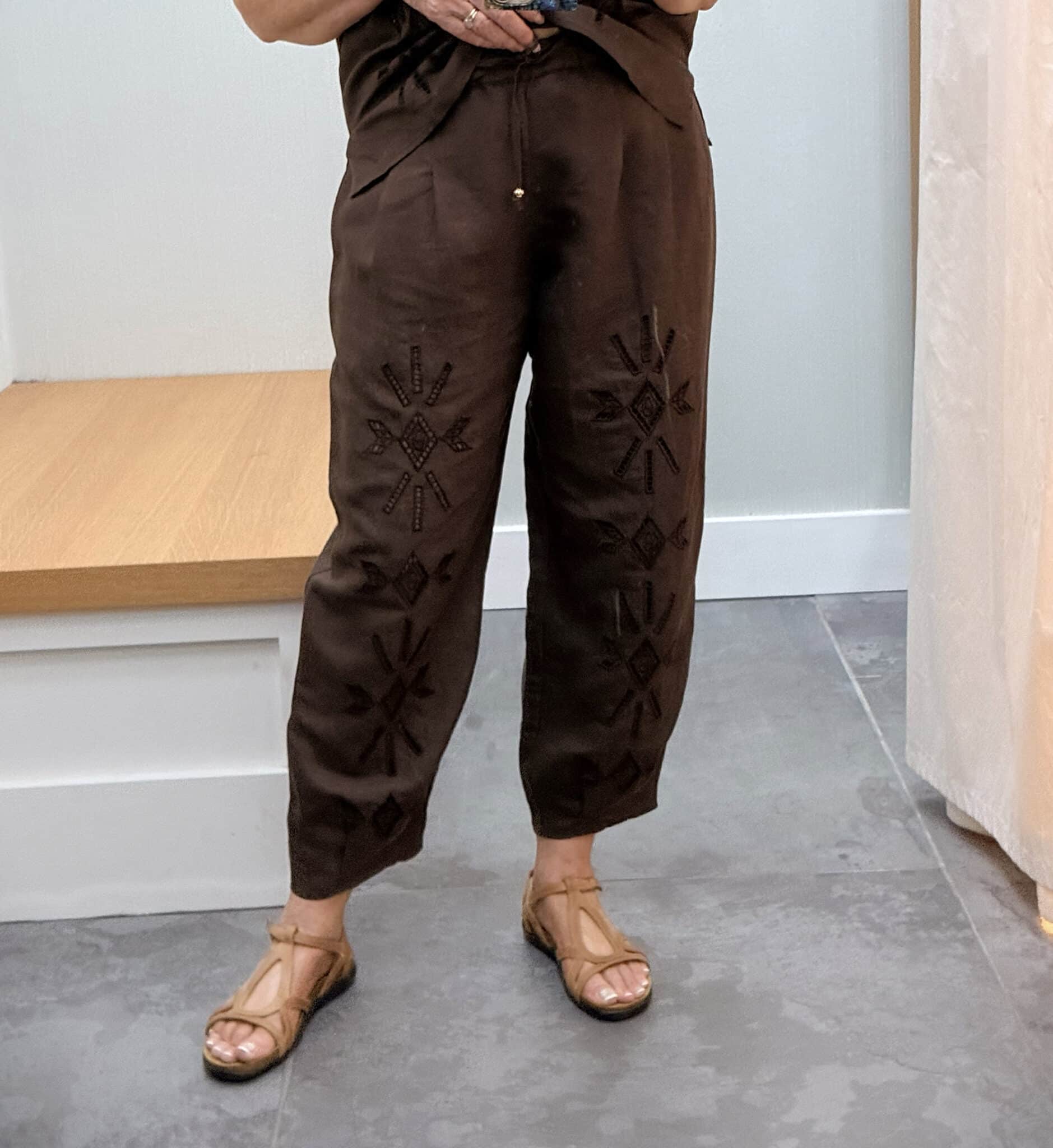 Tania wearing a Johnny Was chocolate brown eyelet brown pants