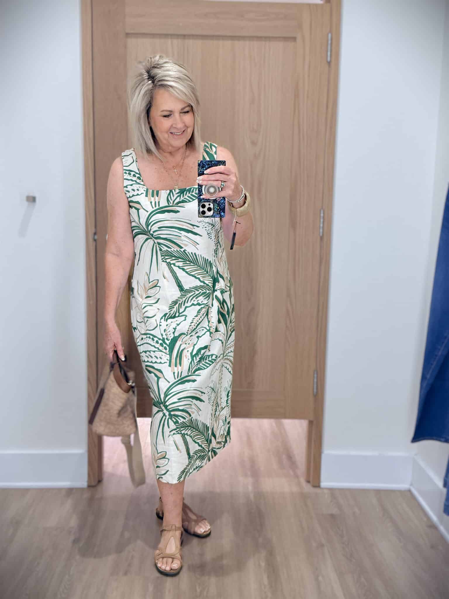 Tania wearing a green and white square neck dress from Ann Taylor