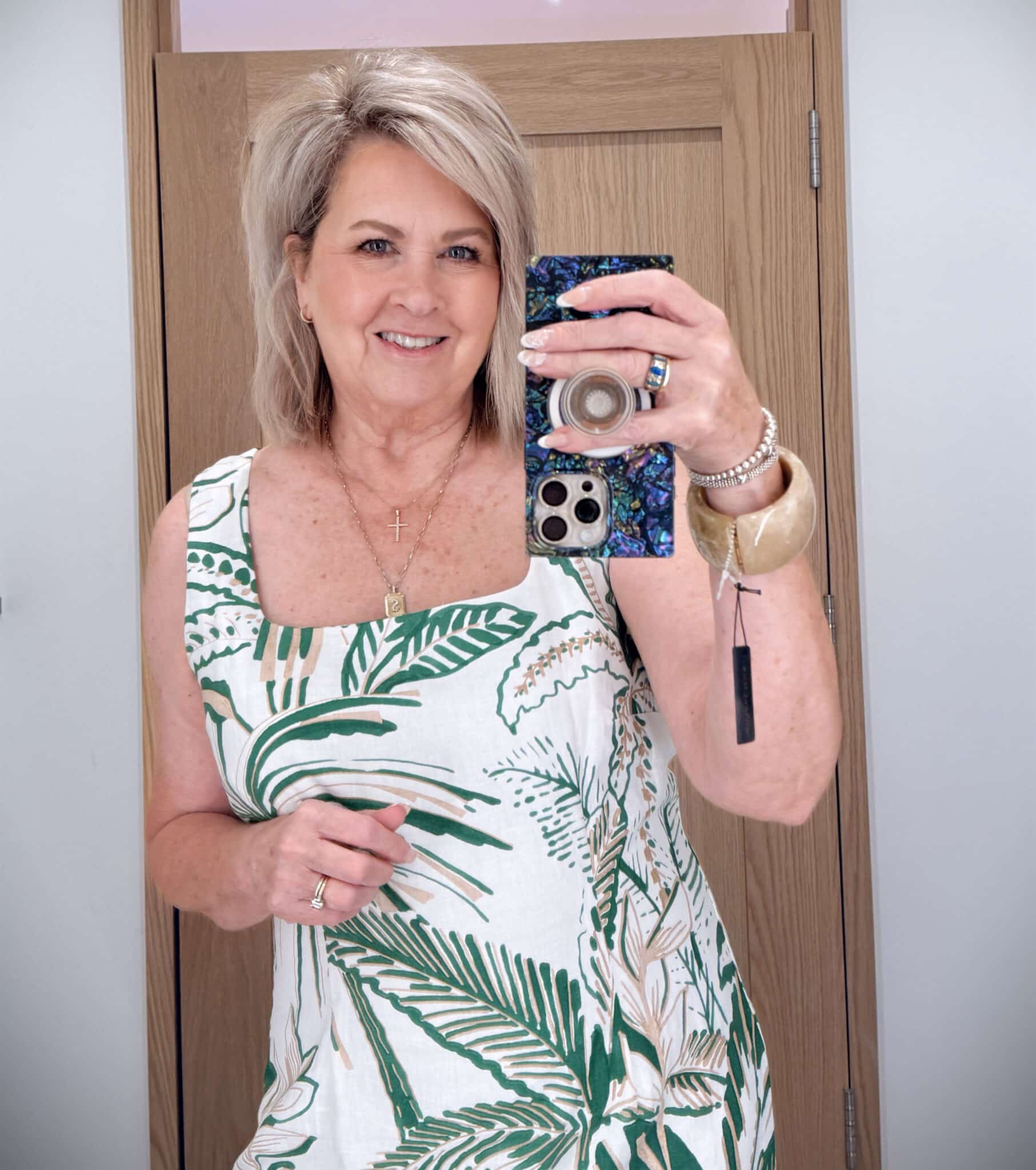 Tania showing a close up of a green and white square neck dress from Ann Taylor