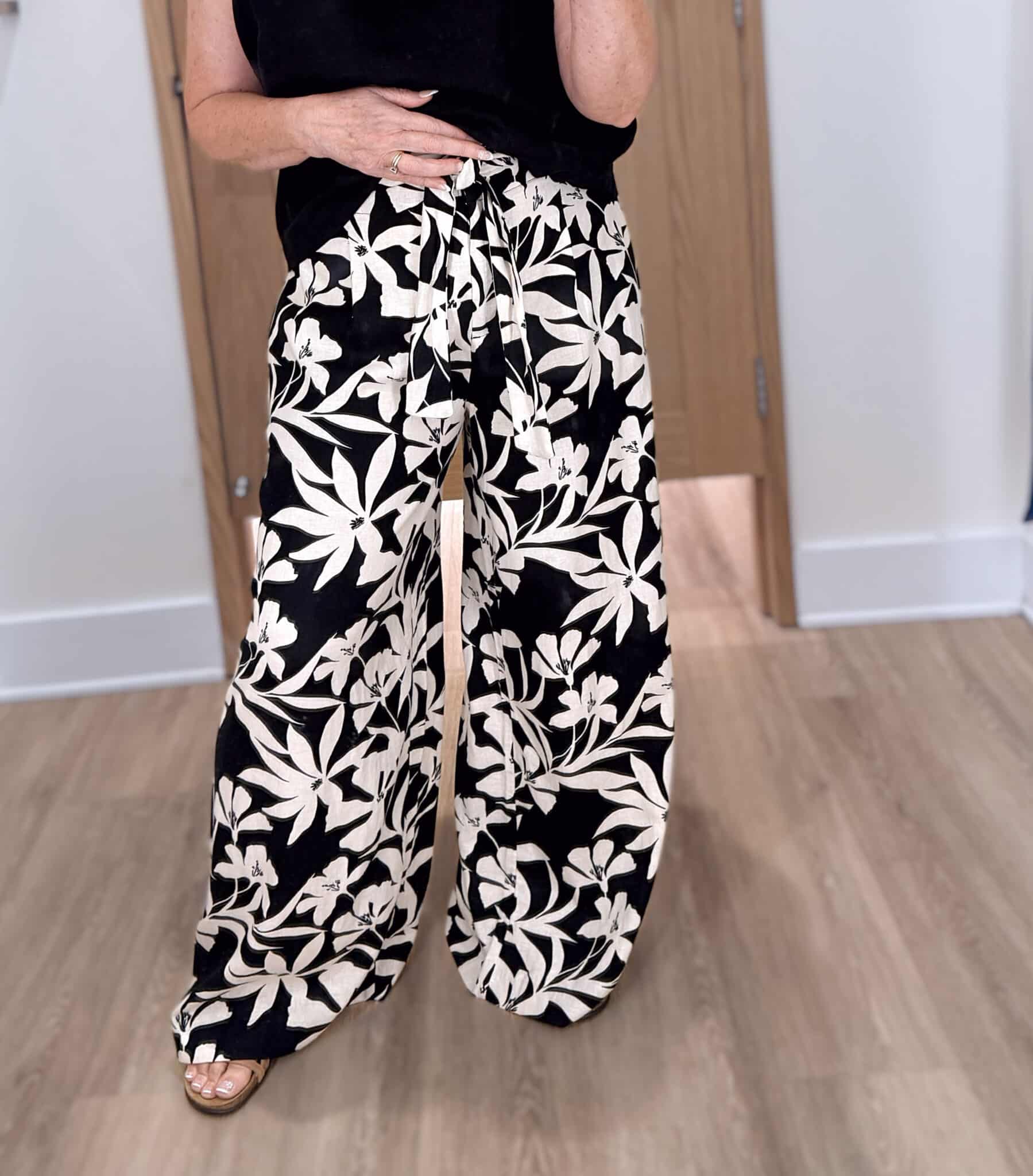 Tania wearing floral wide leg pants from Ann Taylor